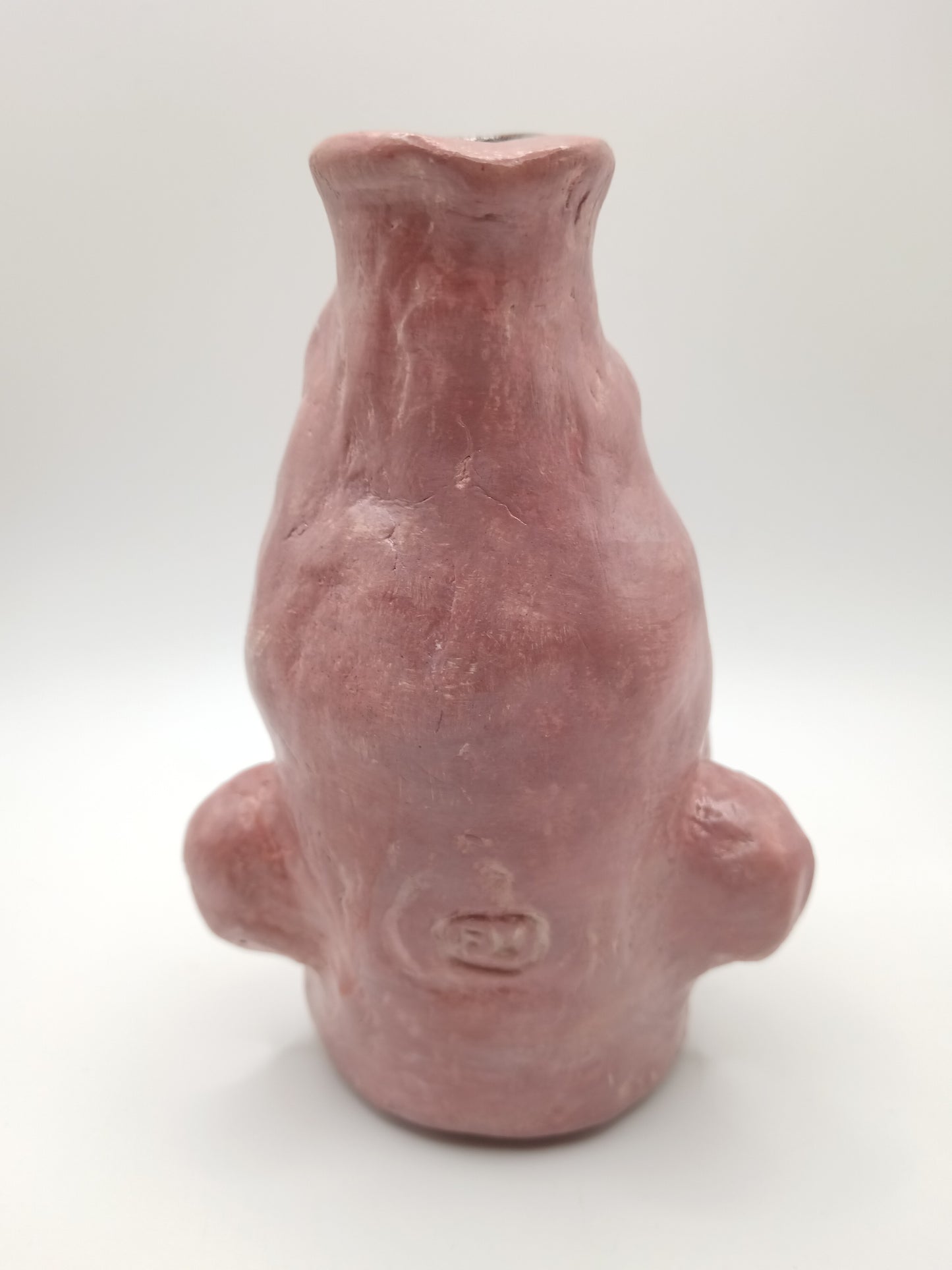 handmade closed-eye clay face vase, back view