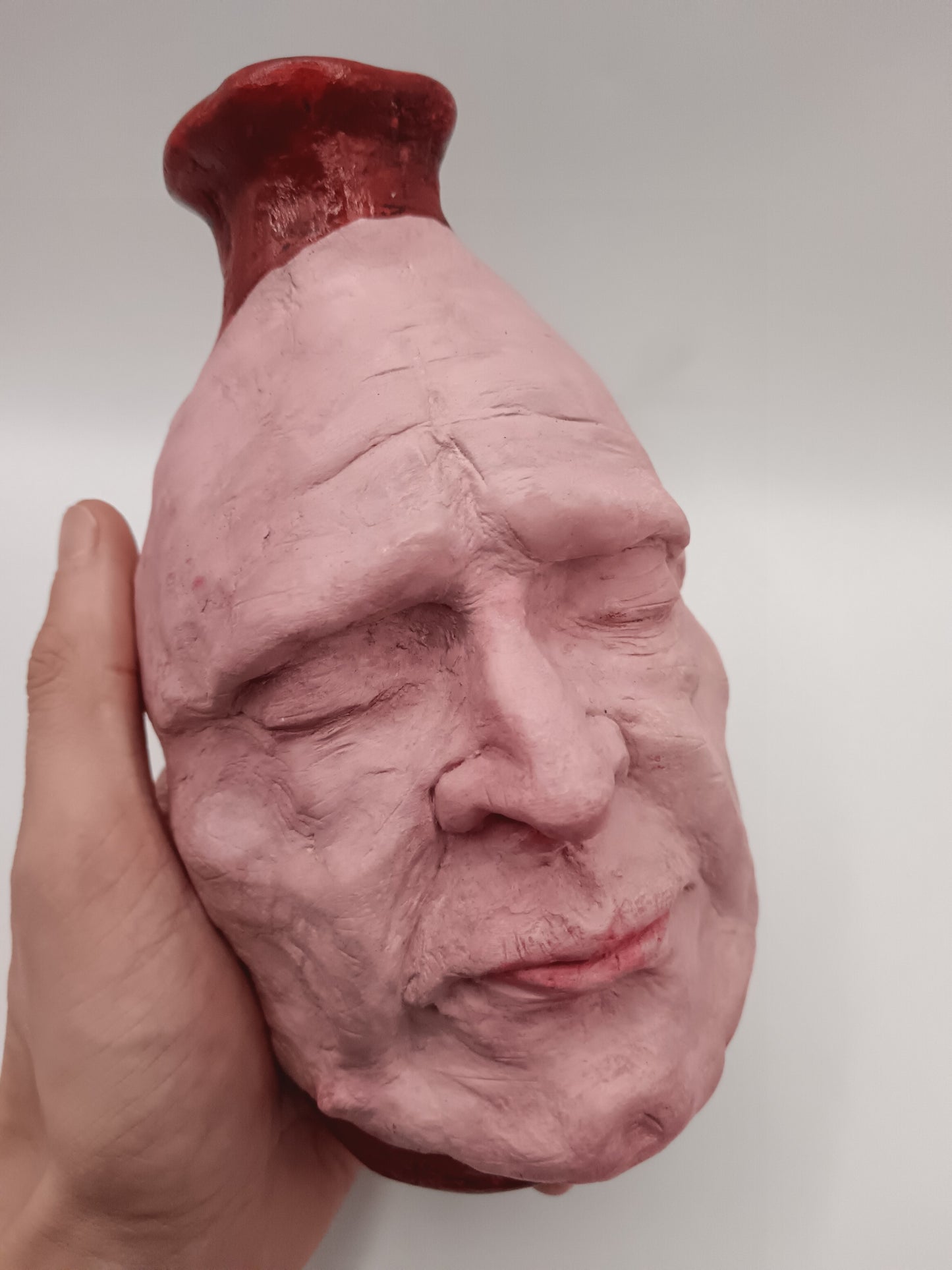Handmade clay death mask vase, hand