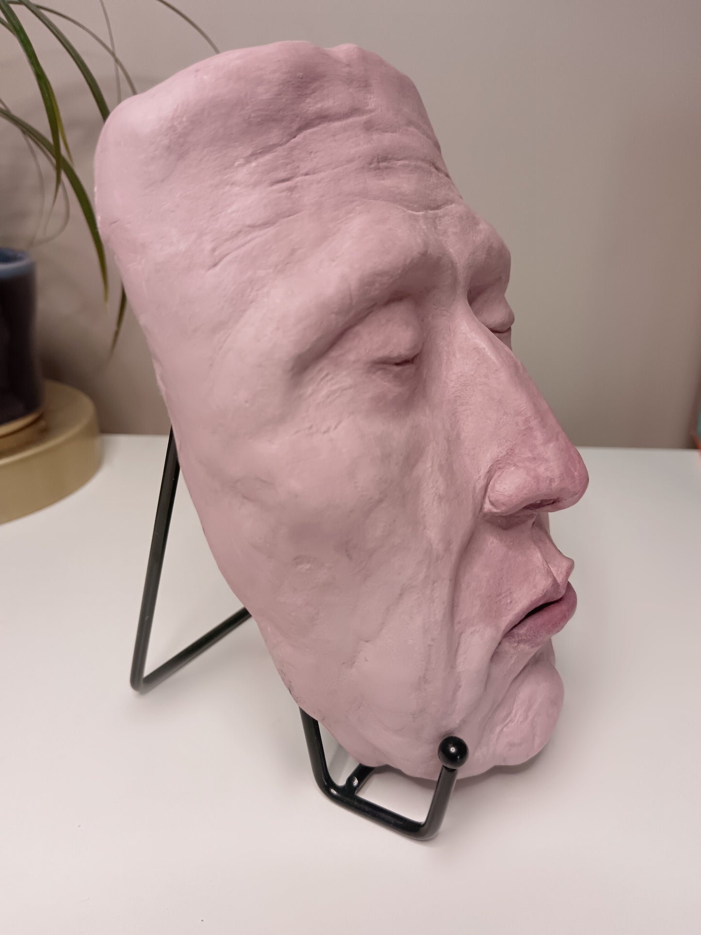 Francis underwater, hand sculpted death mask sculpture with stand, home setting side view
