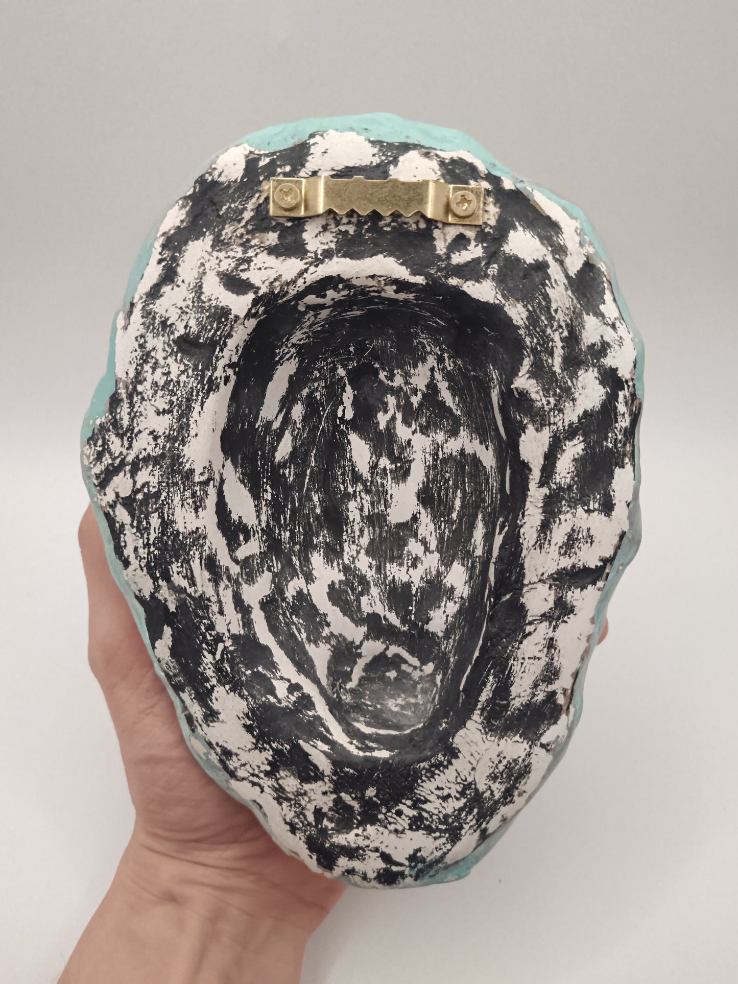 back of mask with sawtooth hanger - ready to hang
