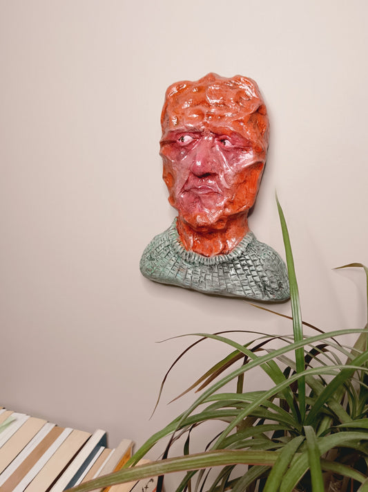 hand sculpted clay alien art, home setting wall mounted