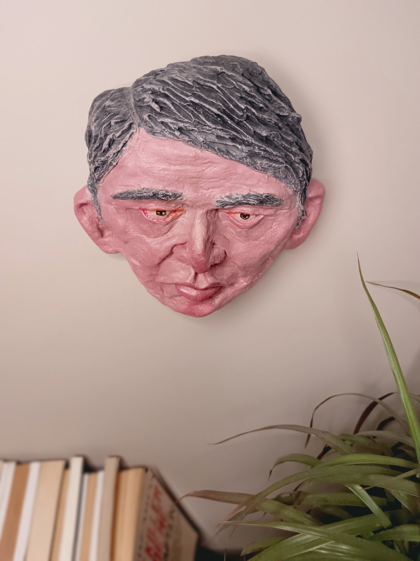 male clay sculpture wall mounted top view