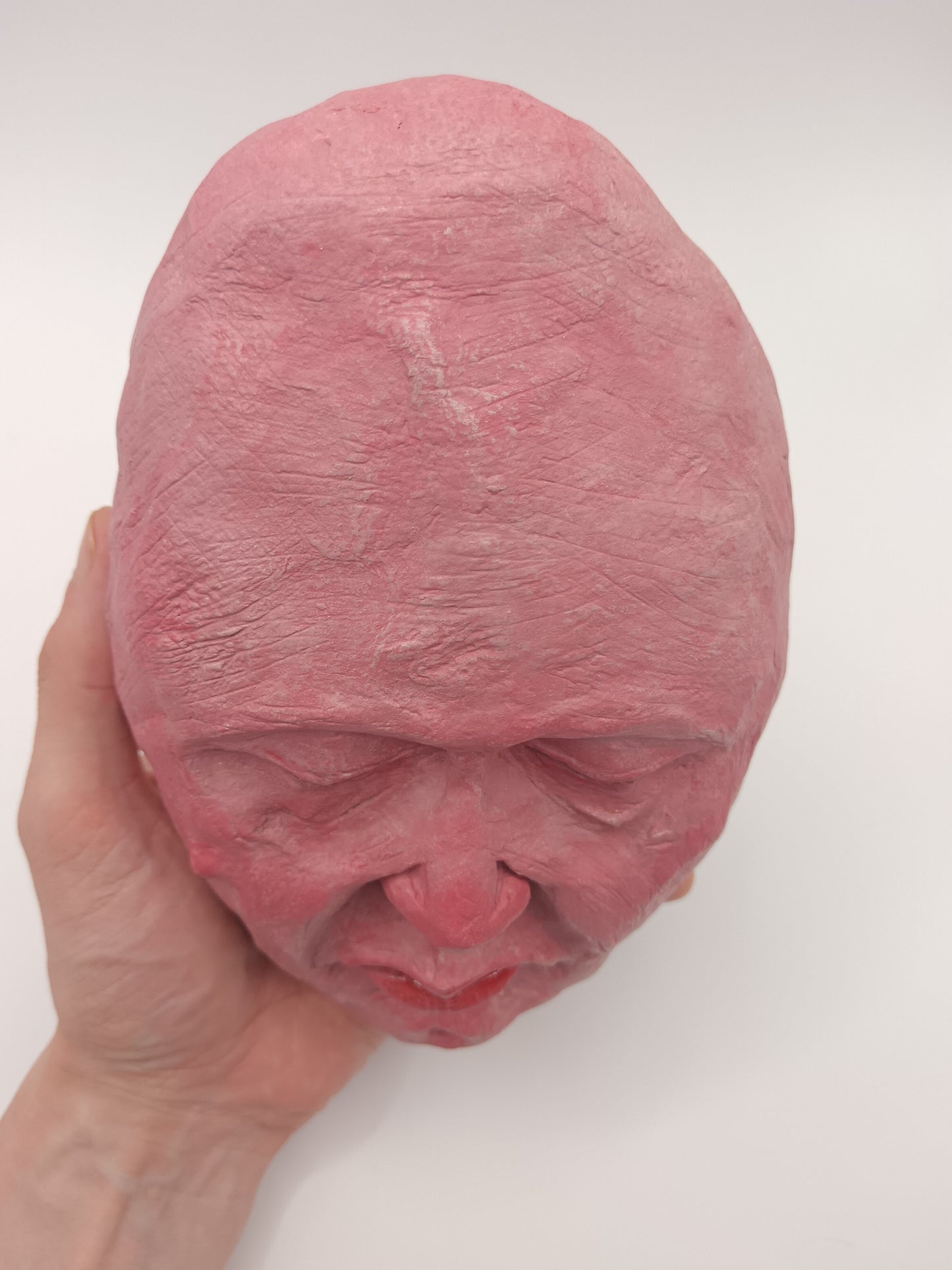 hand sculpted egghead sculpture, top view