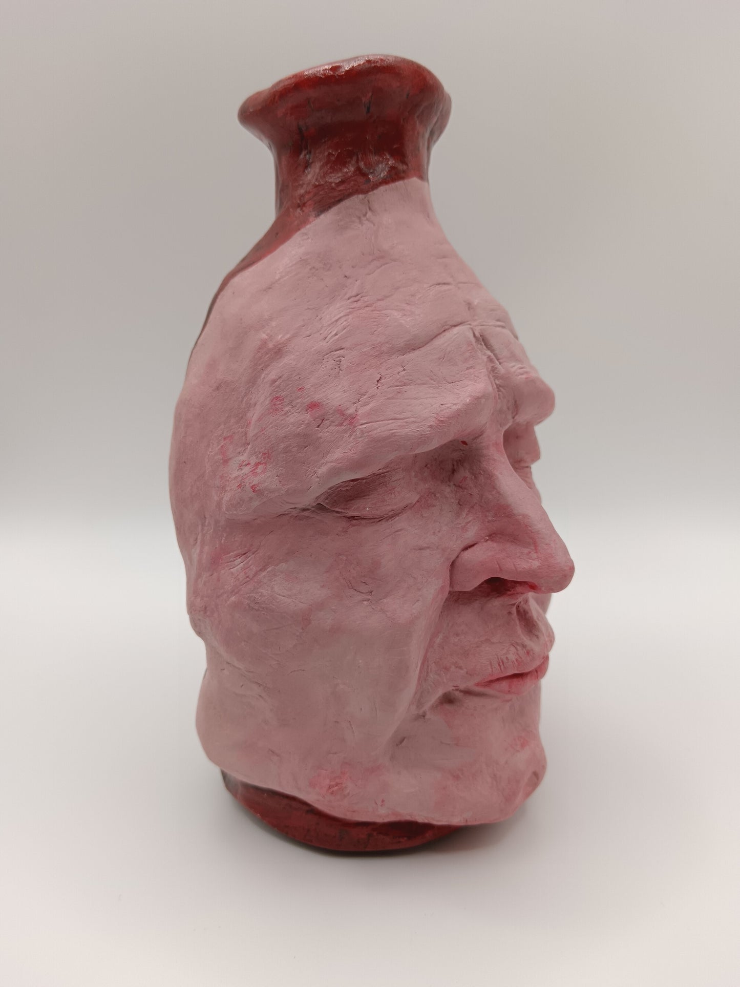 Handmade clay death mask vase, front right