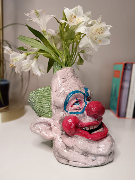 Killer Klowns from Outer Space clay sculpture vase with flowers right side