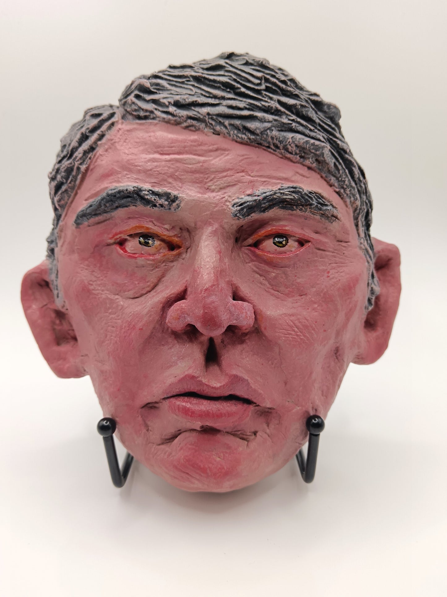 male clay sculpture with stand front view