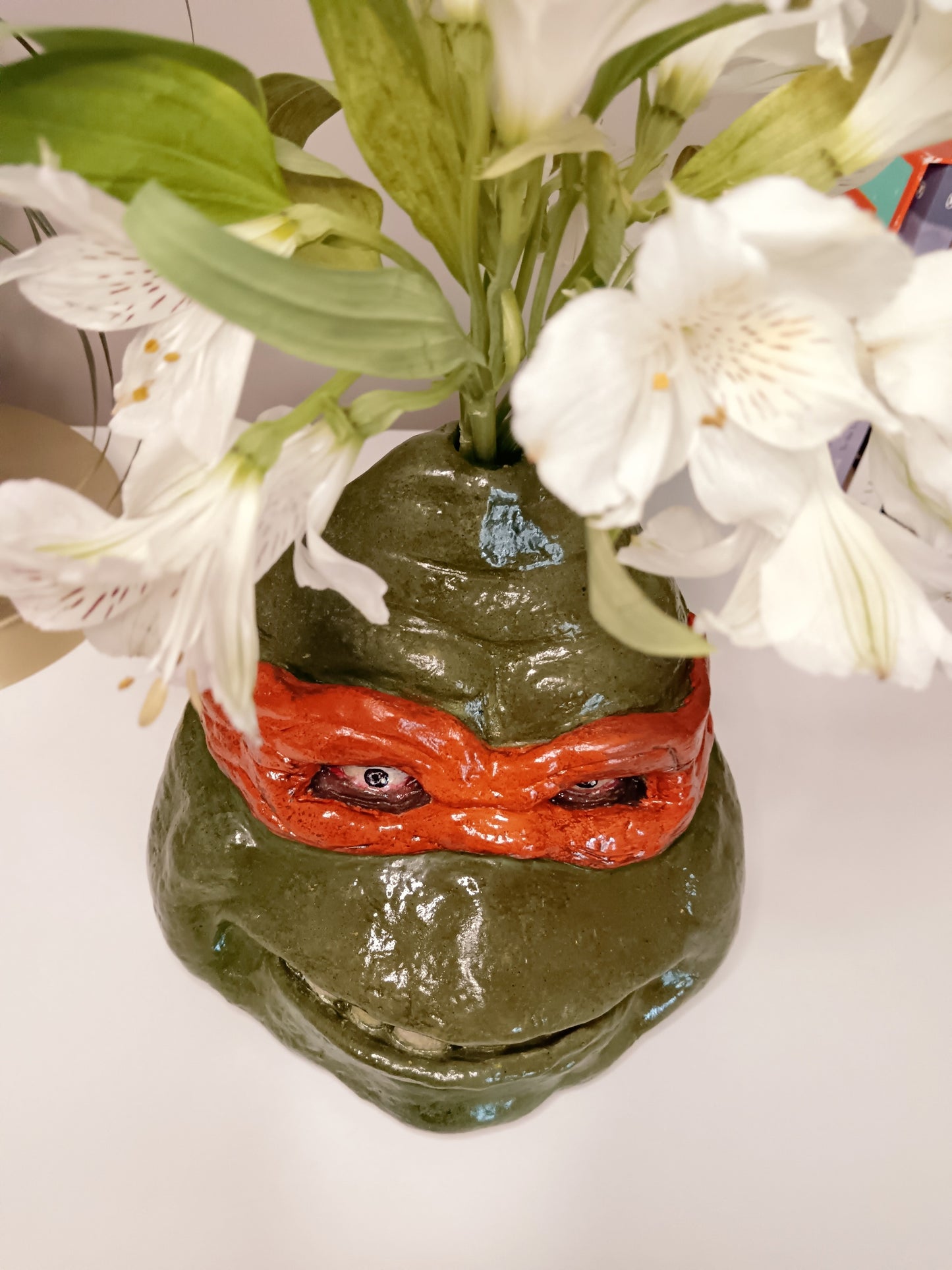 teenage mutant ninja turtles sculpture vase with flowers top view