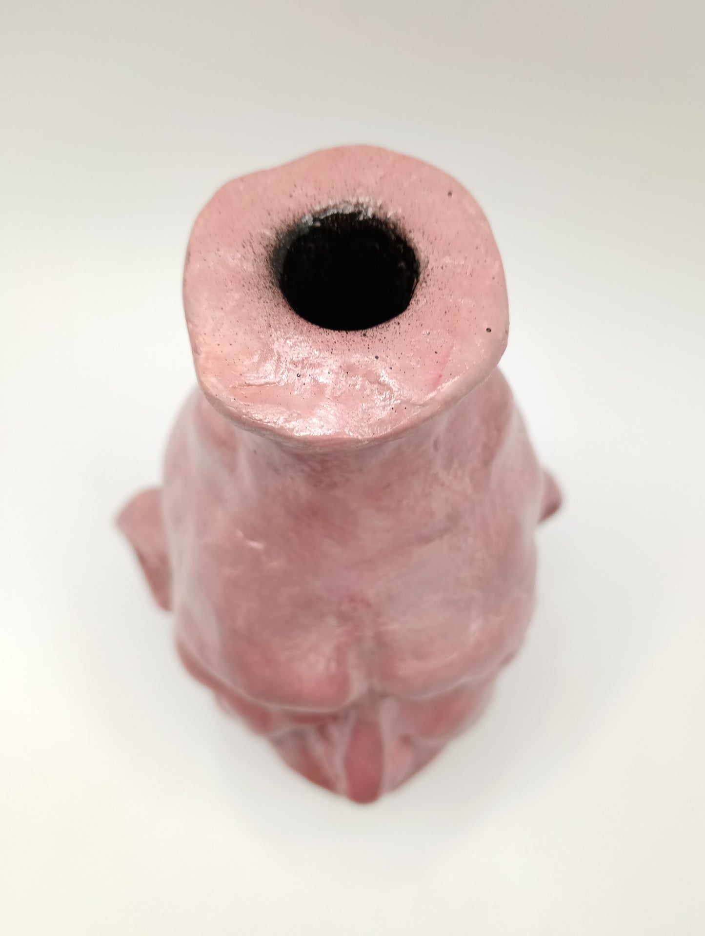 handmade closed-eye clay face vase, top view