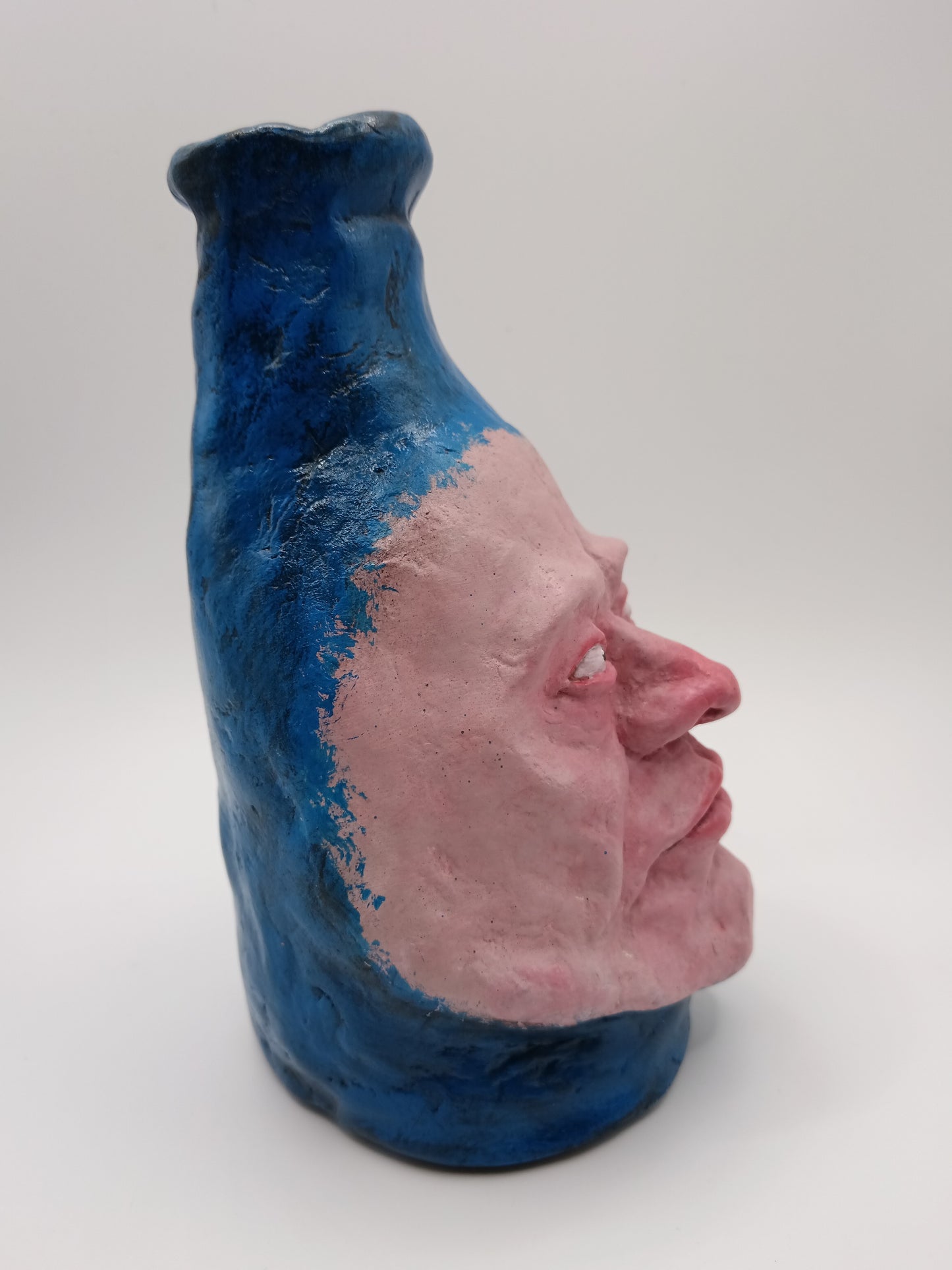Hand sculpted blue face Vase - right view