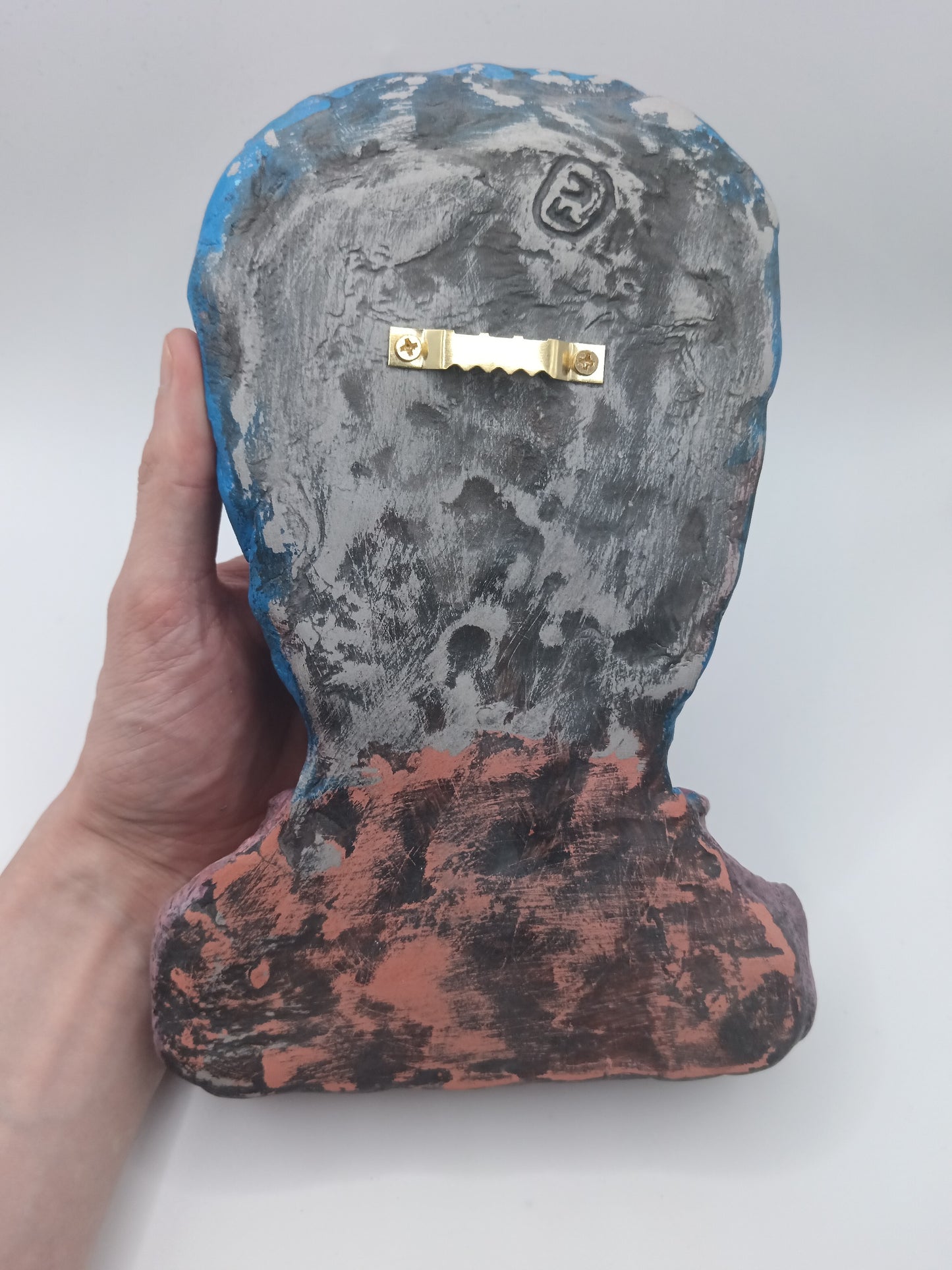 handmade clay alien sculpture, back