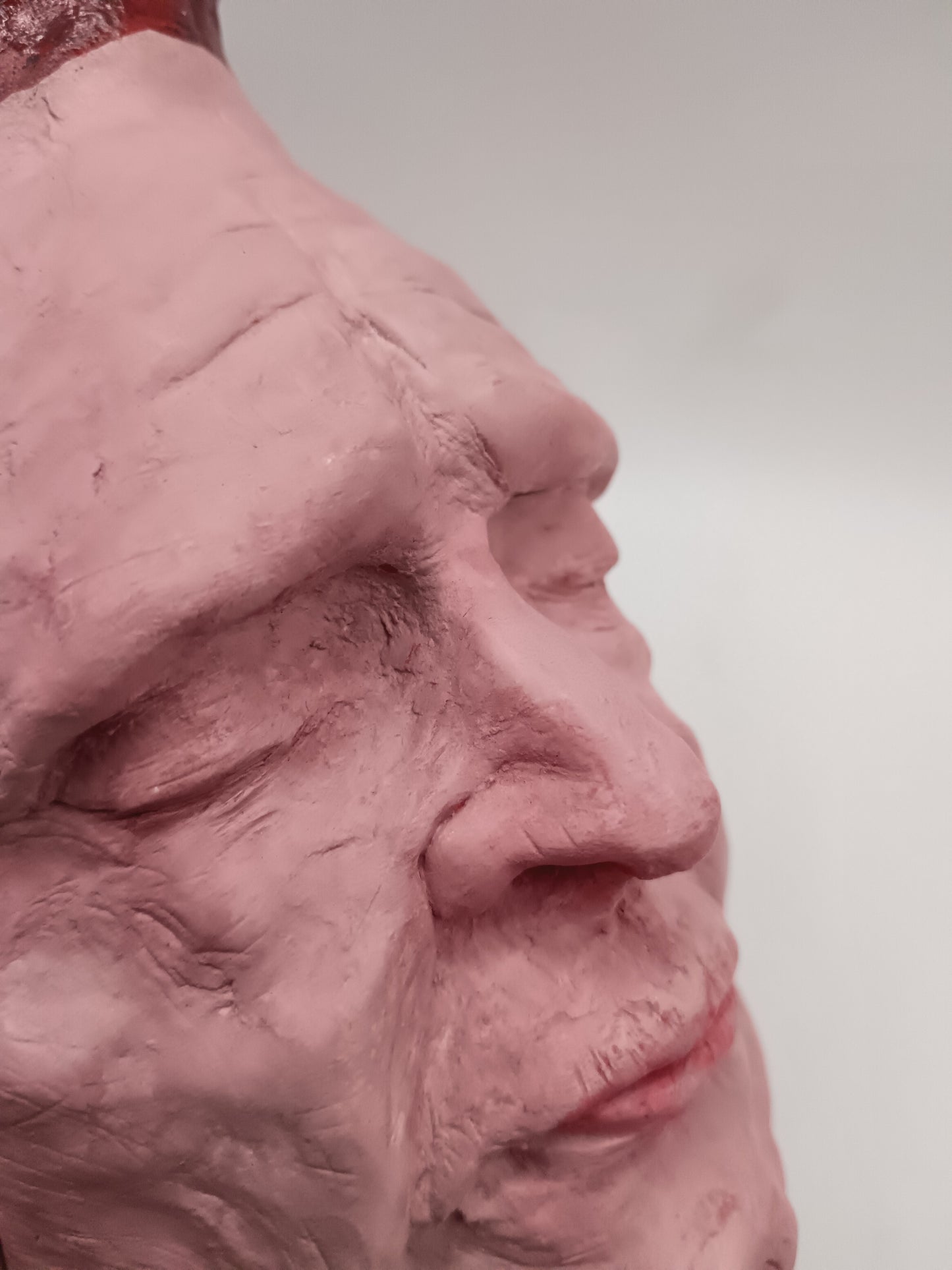 Handmade clay death mask vase, detail close-up