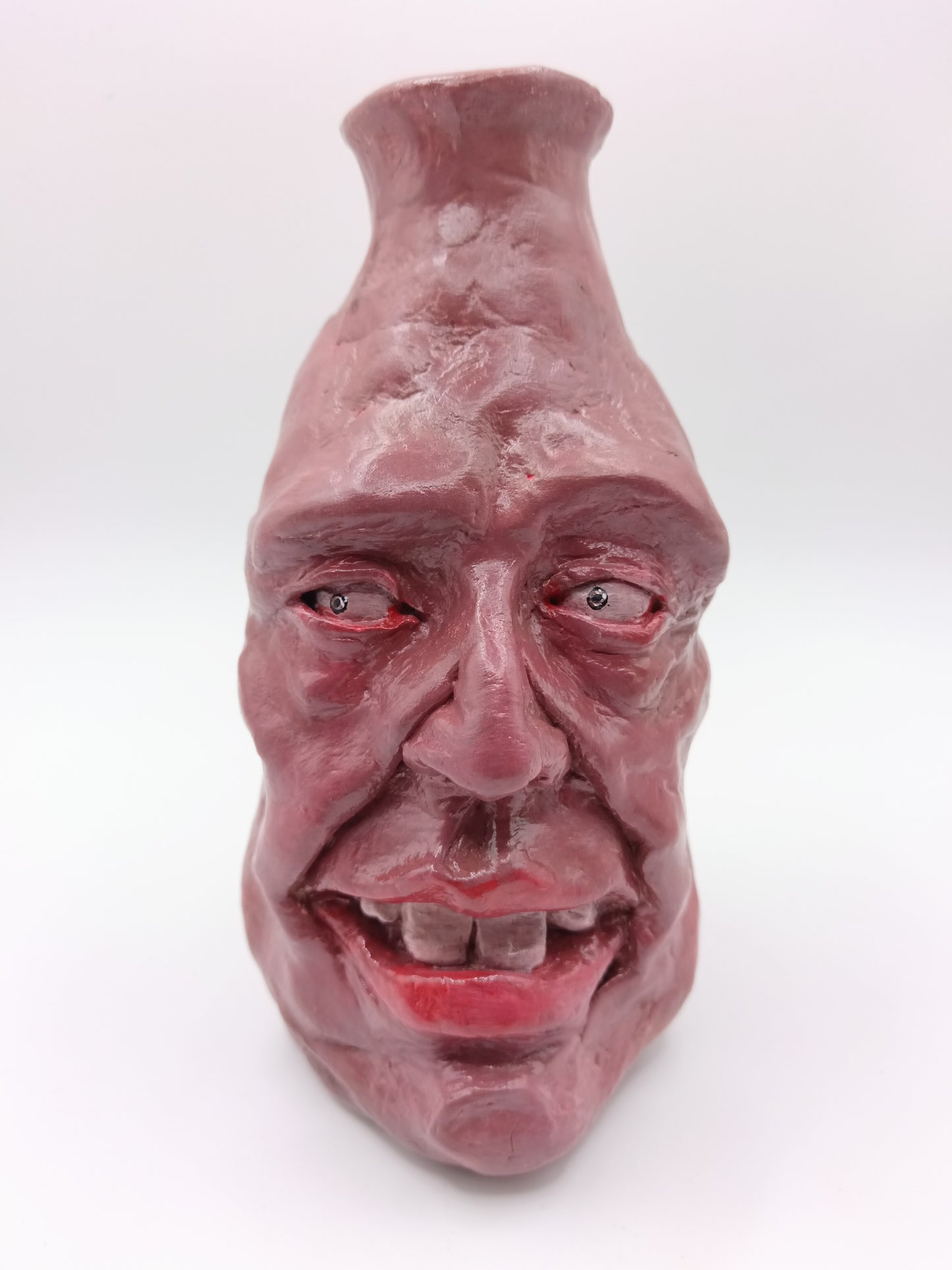 Handmade caricature face vase, front view