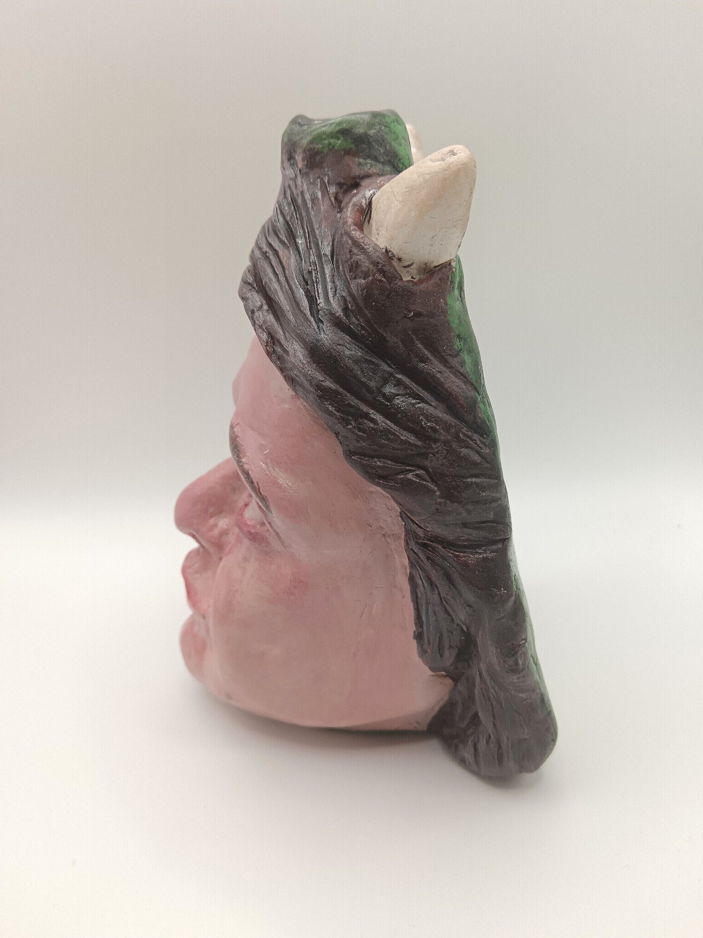 Handmade clay devil girl vase, left