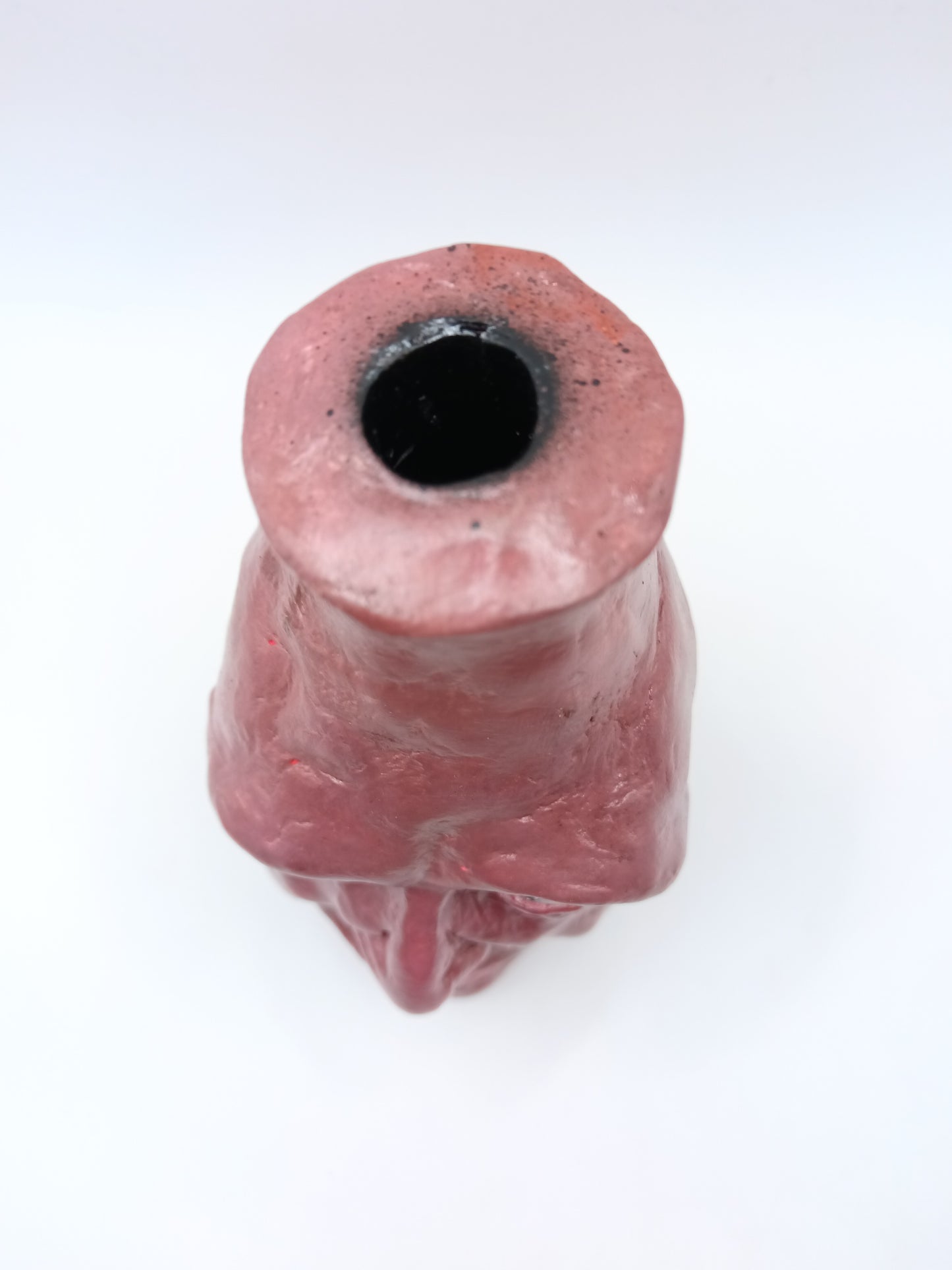Handmade caricature face vase, top view
