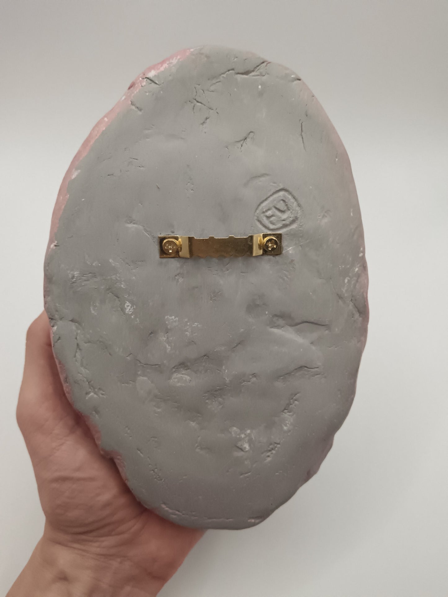 hand sculpted egghead sculpture, back, sawtooth hanger