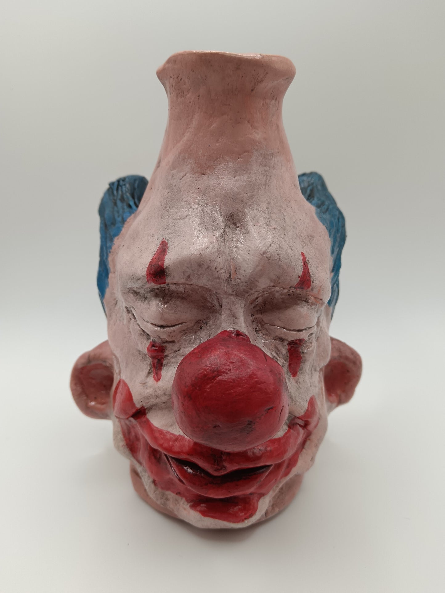 Handmade clay clown vases with blue hair