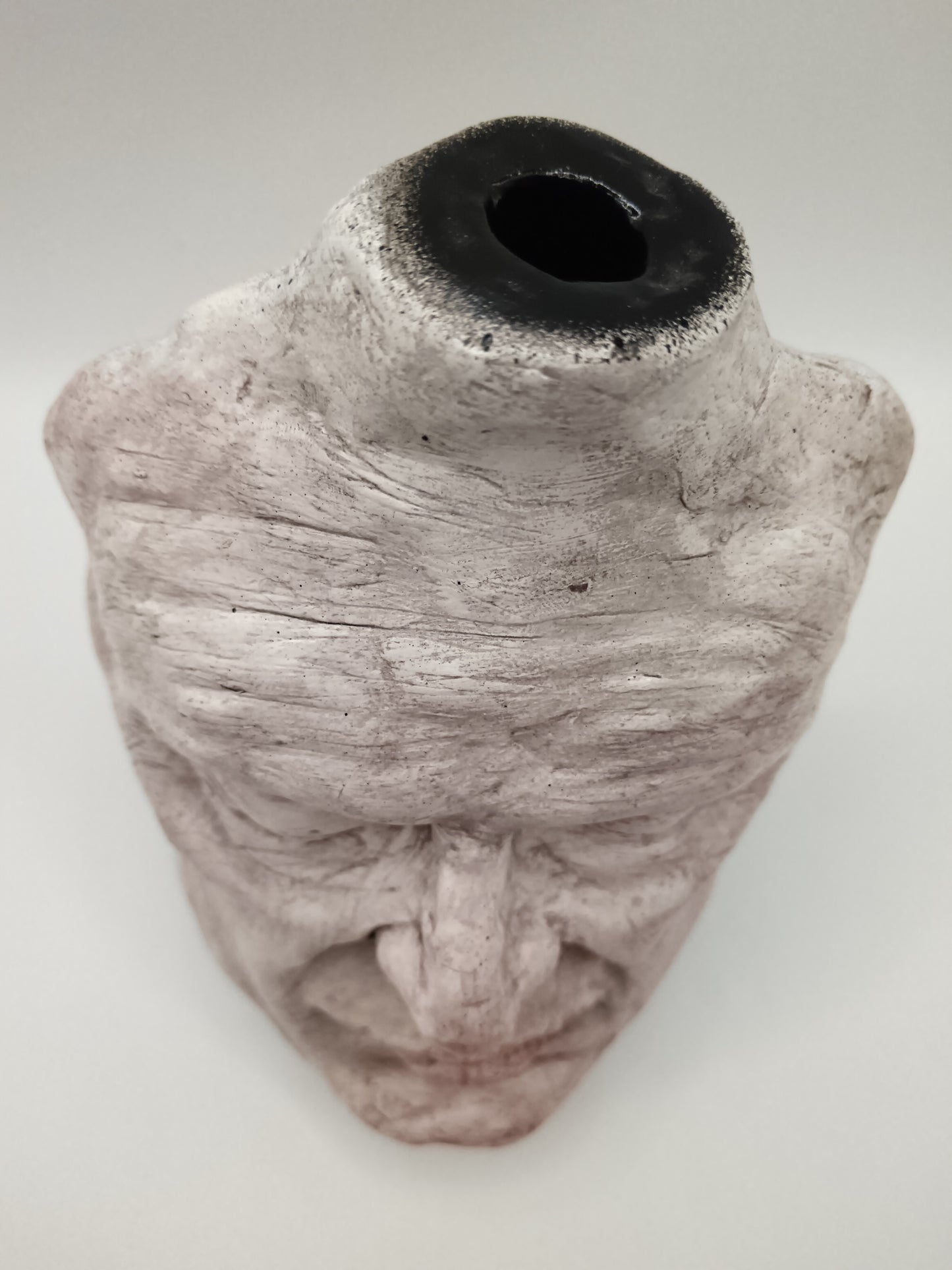 Airy dry clay vase - male face, top