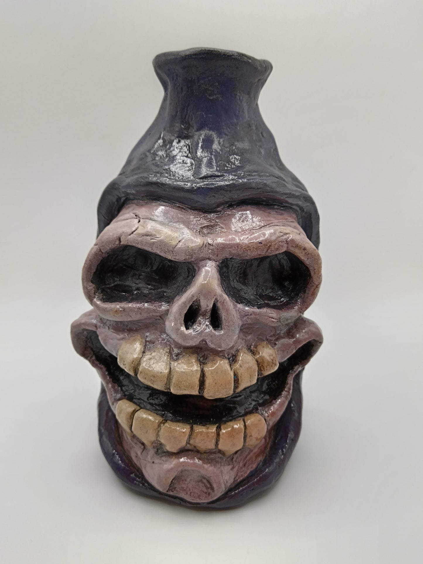Hand made clay skull vase purple grim reaper front view