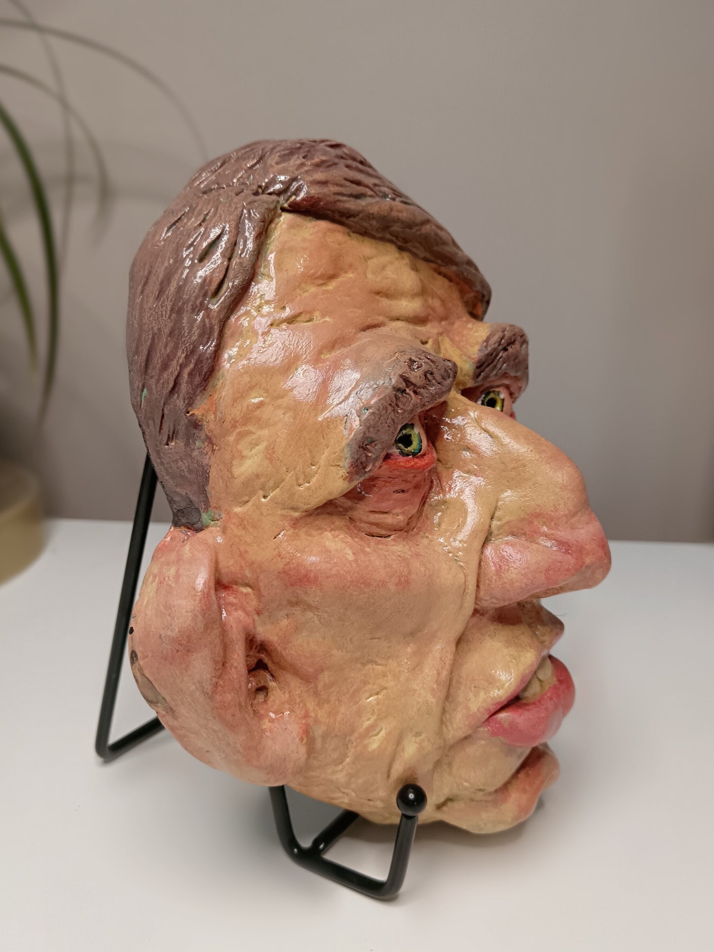 Hand sculpted clay yellow face mask sculpture side view