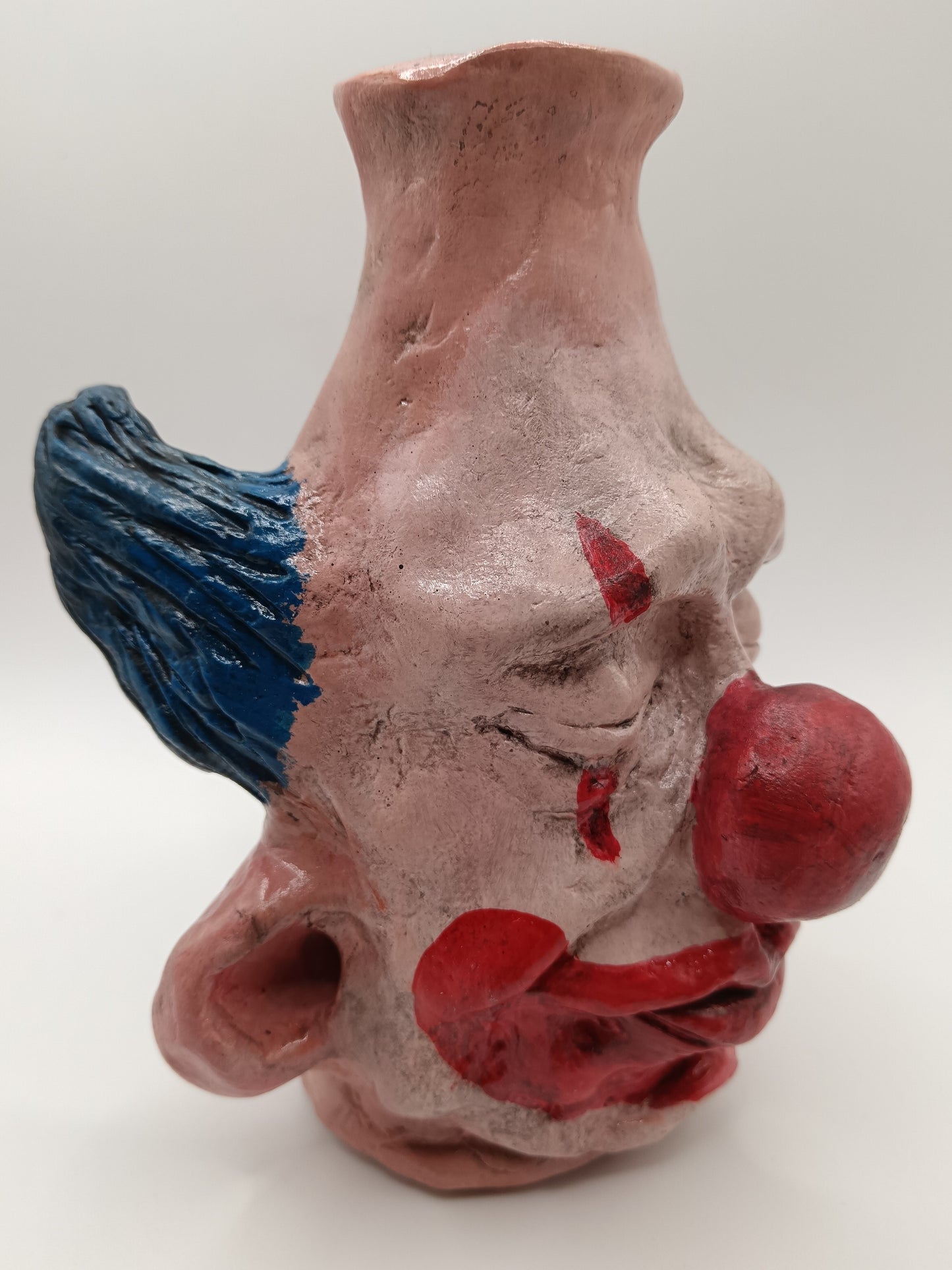 Handmade clay clown vases with blue hair side view right