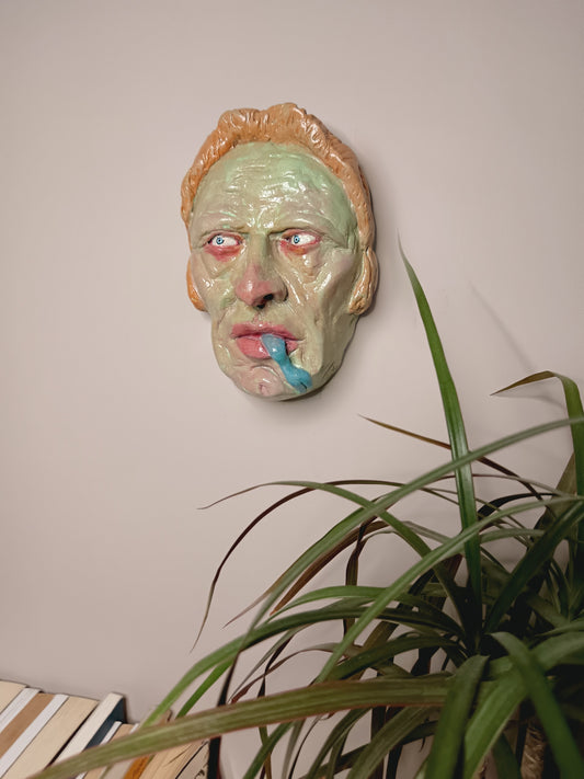 hand sculpted lizard man clay sculpture wall mounted