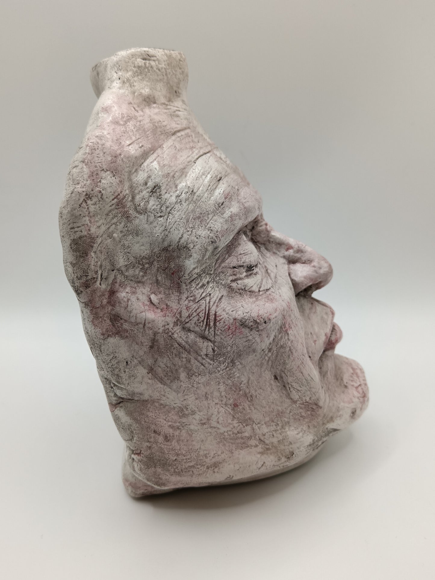 Airy dry clay vase - male face, right side