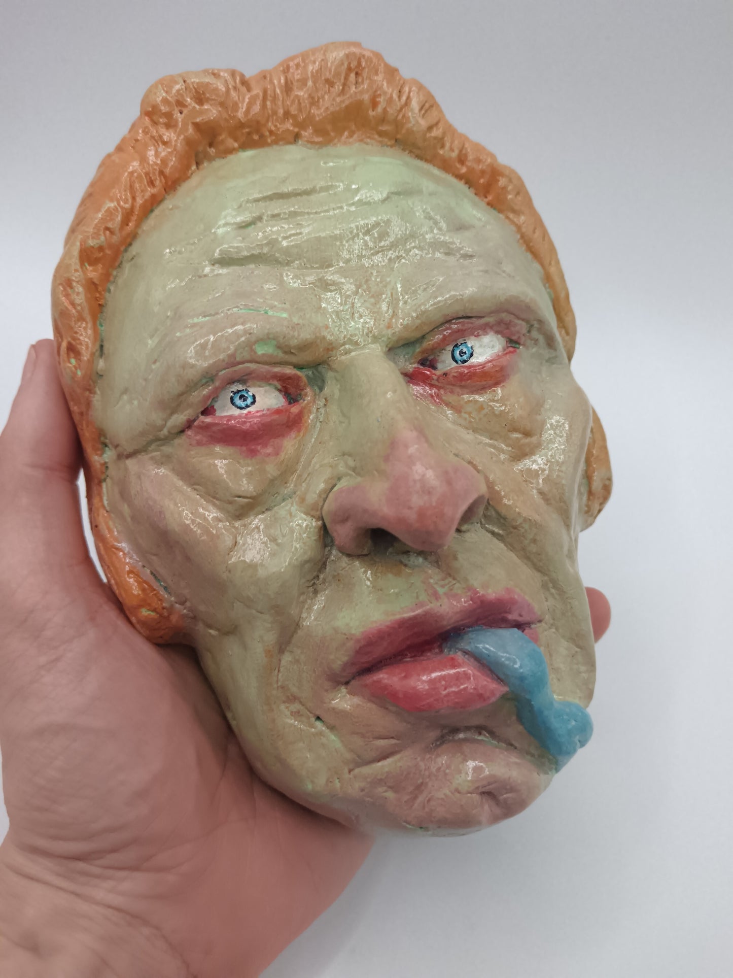 hand sculpted lizard man clay sculpture