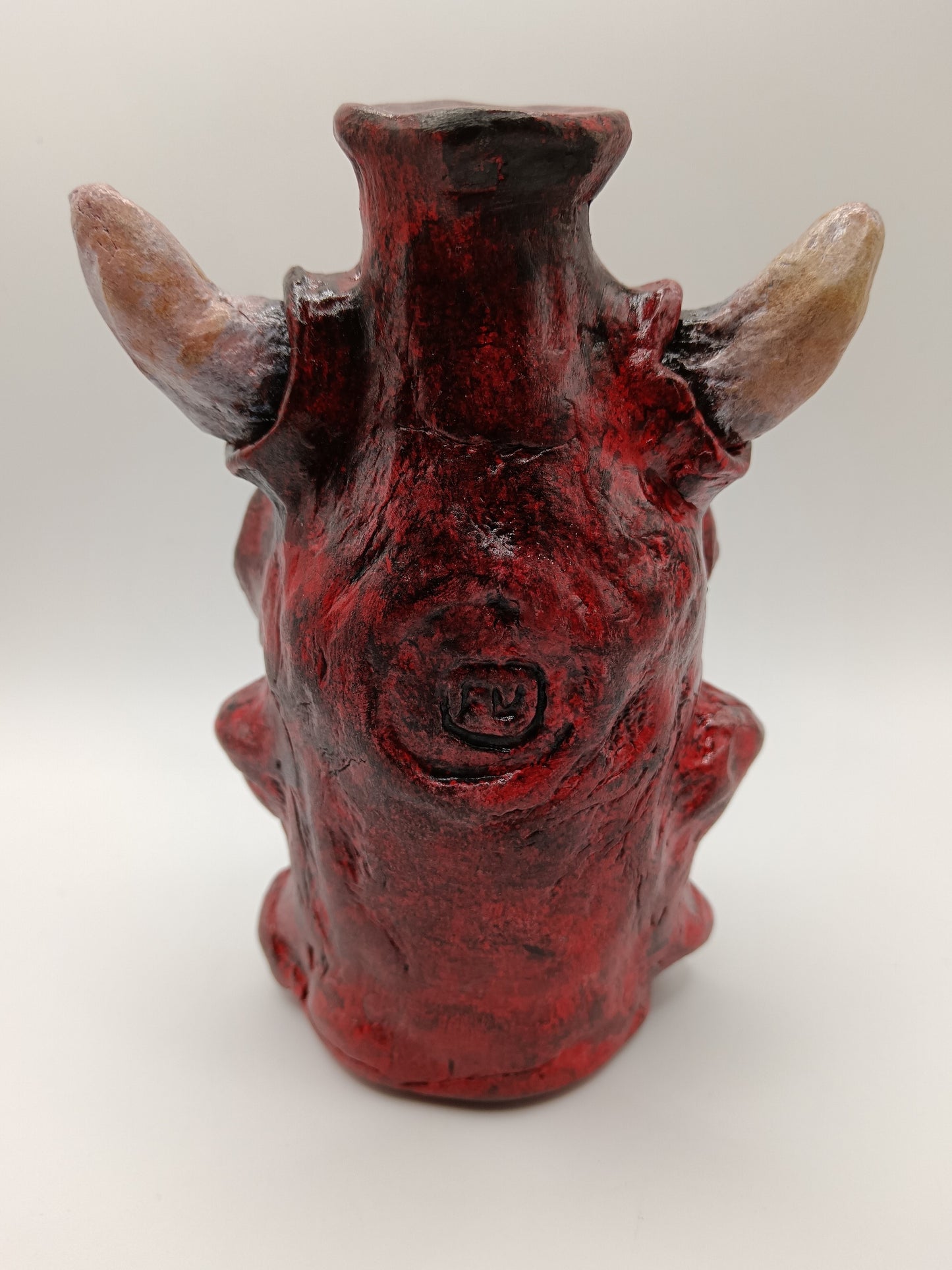 Hand made clay red skull vase with horns back