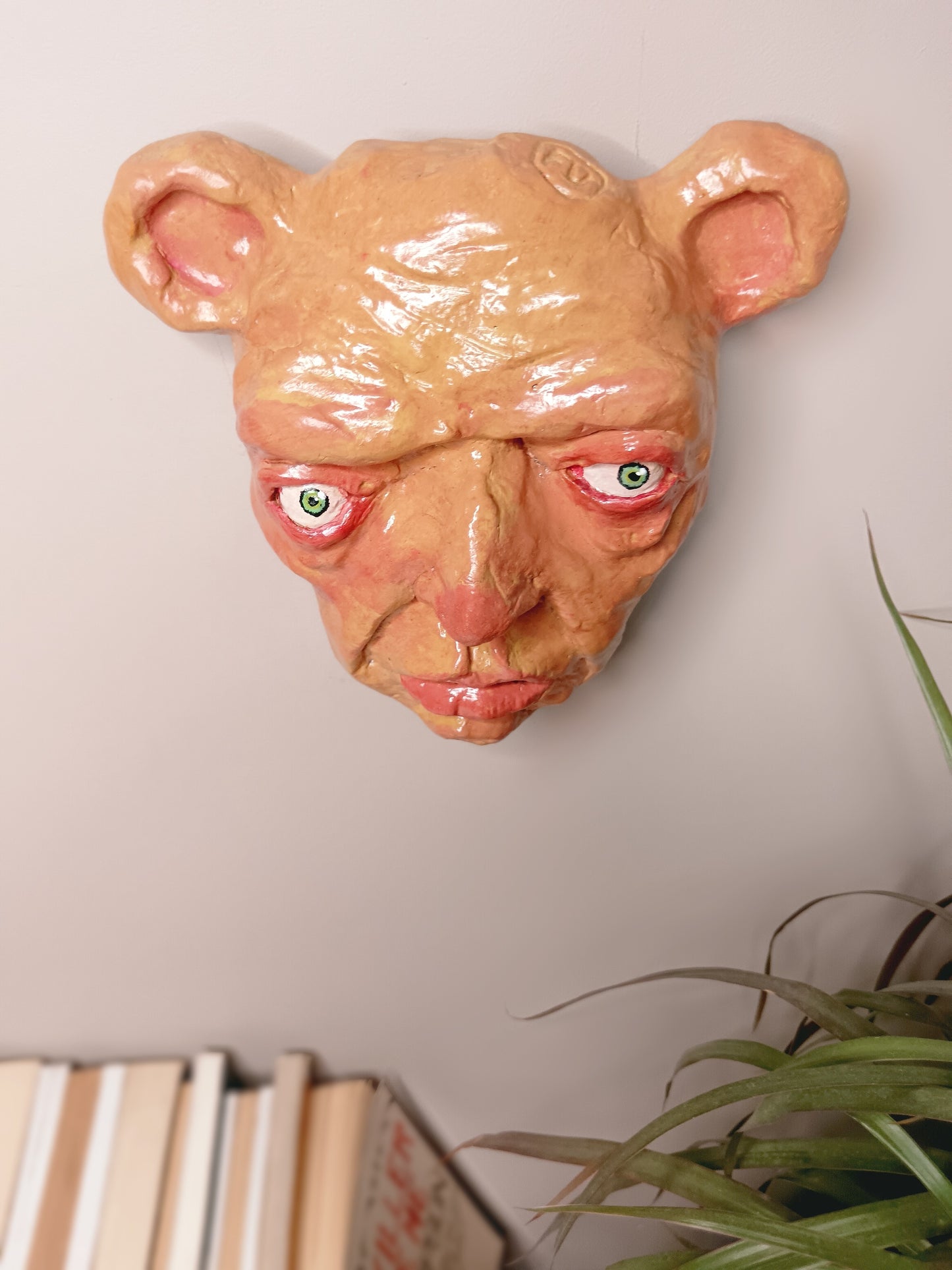 creepy yellow bear, hand sculpted clay sculpture mask wall hanging, top