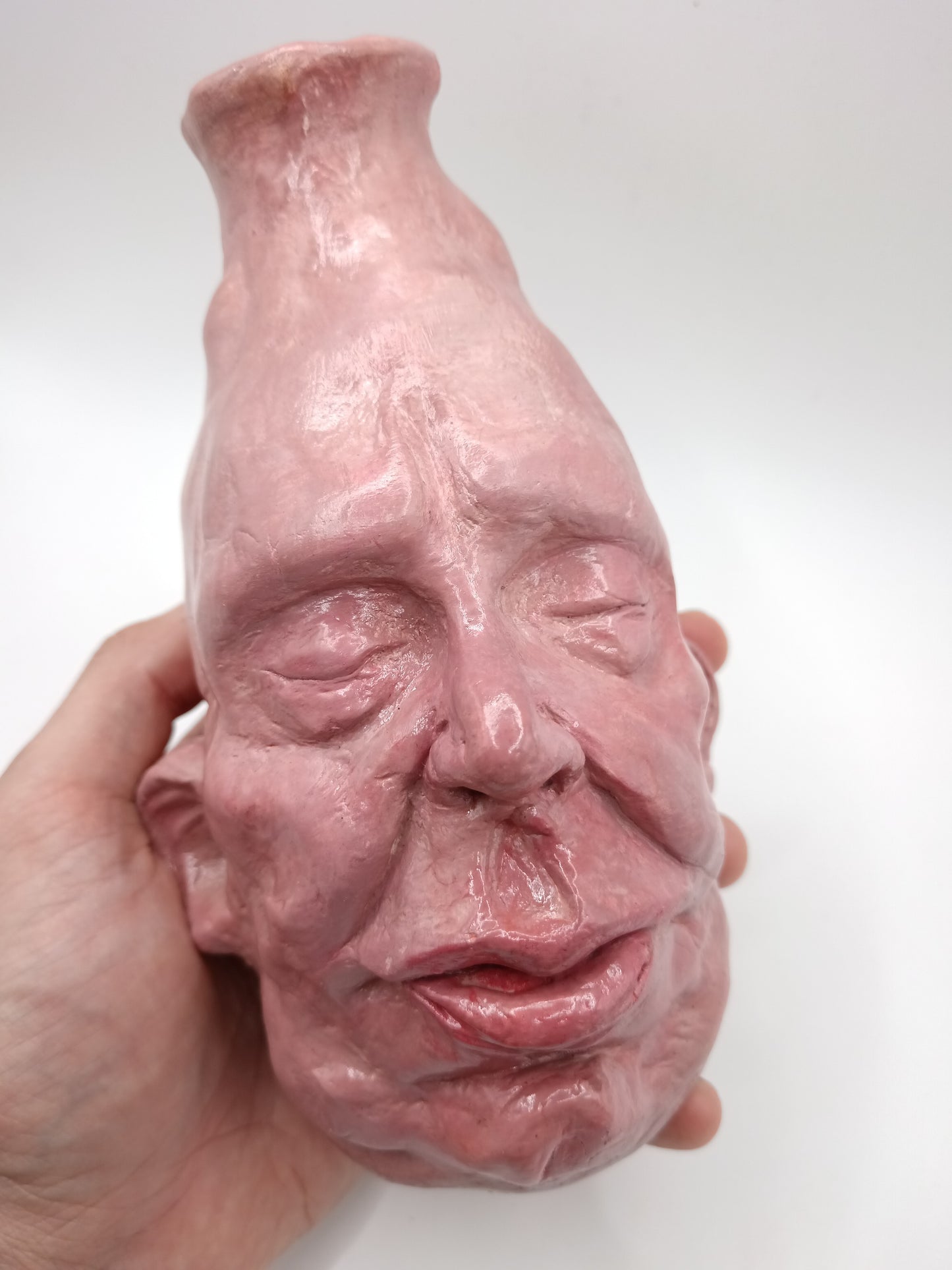 handmade closed-eye clay face vase