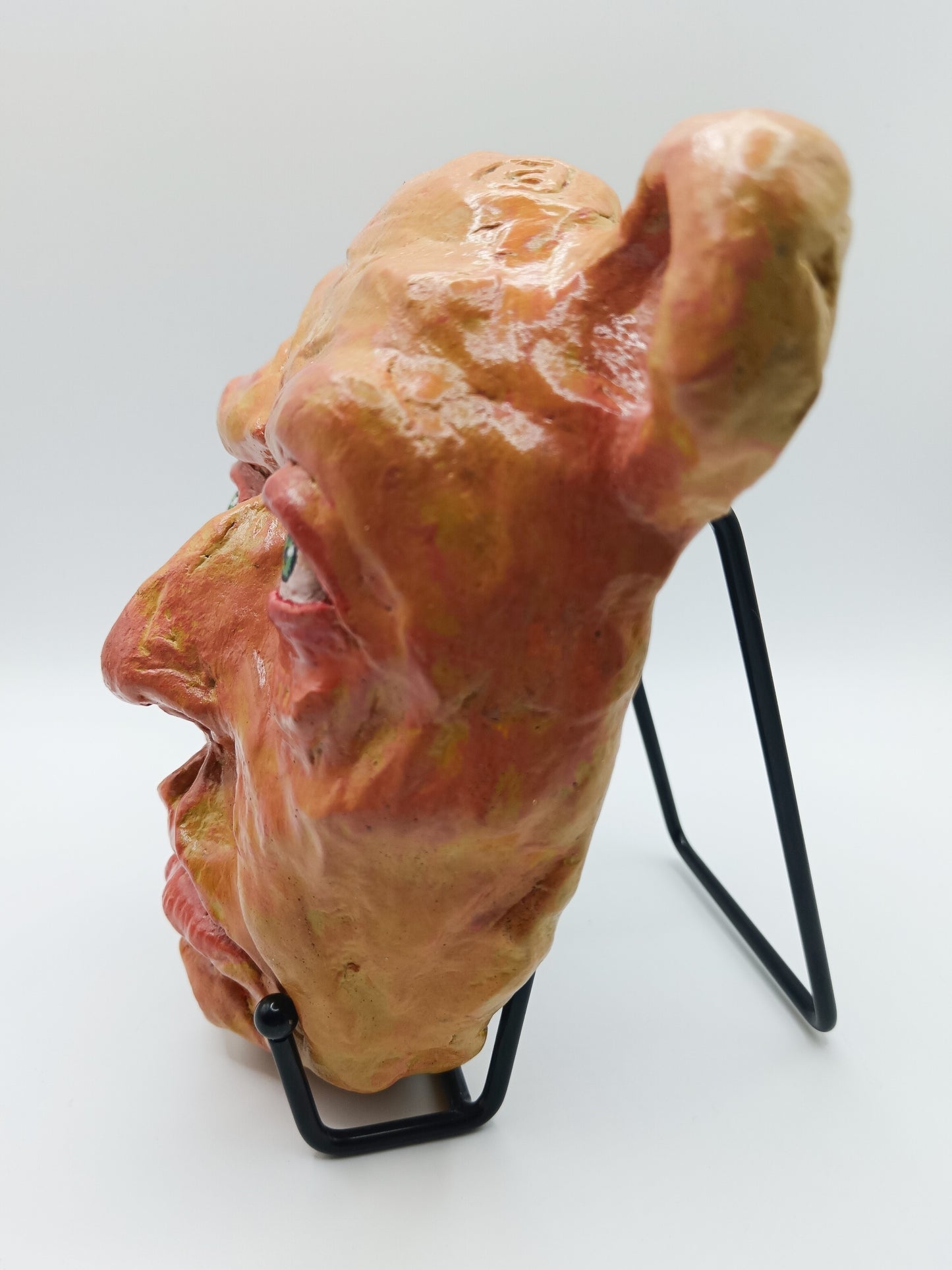 creepy yellow bear, hand sculpted clay sculpture mask with stand left view
