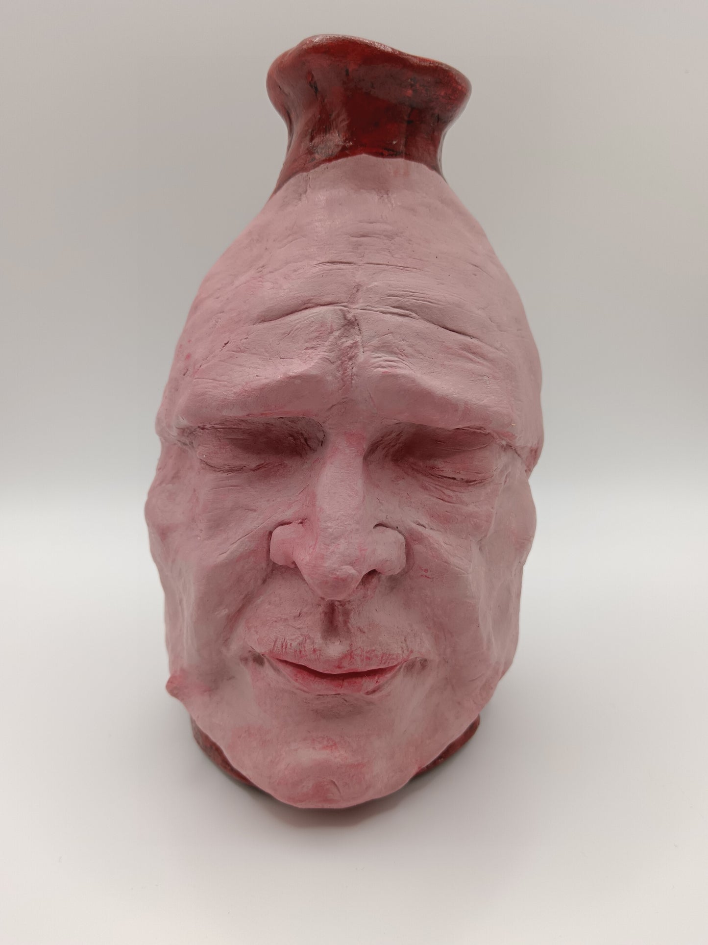 Handmade clay death mask vase, front