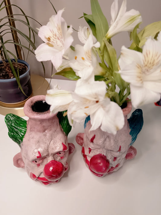 Handmade clown vases with flowers top view