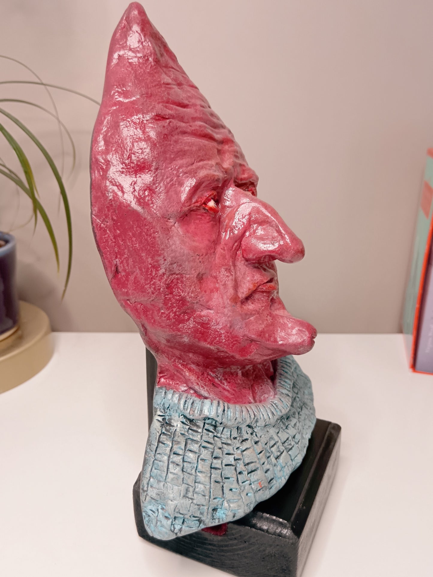 handmade airdry clay alien sculpture, home setting side