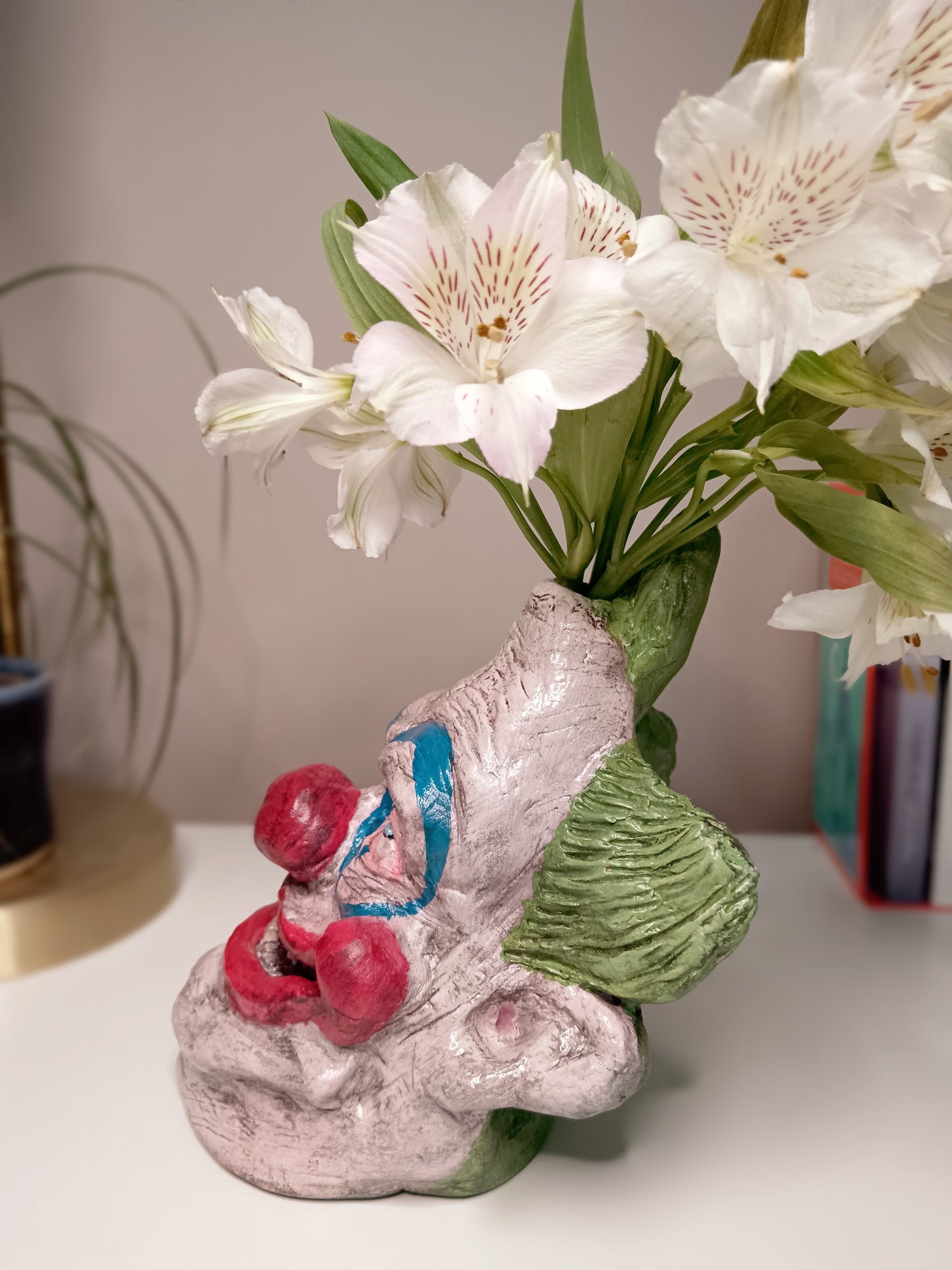 Killer Klowns from Outer Space clay sculpture vase with flowers left side