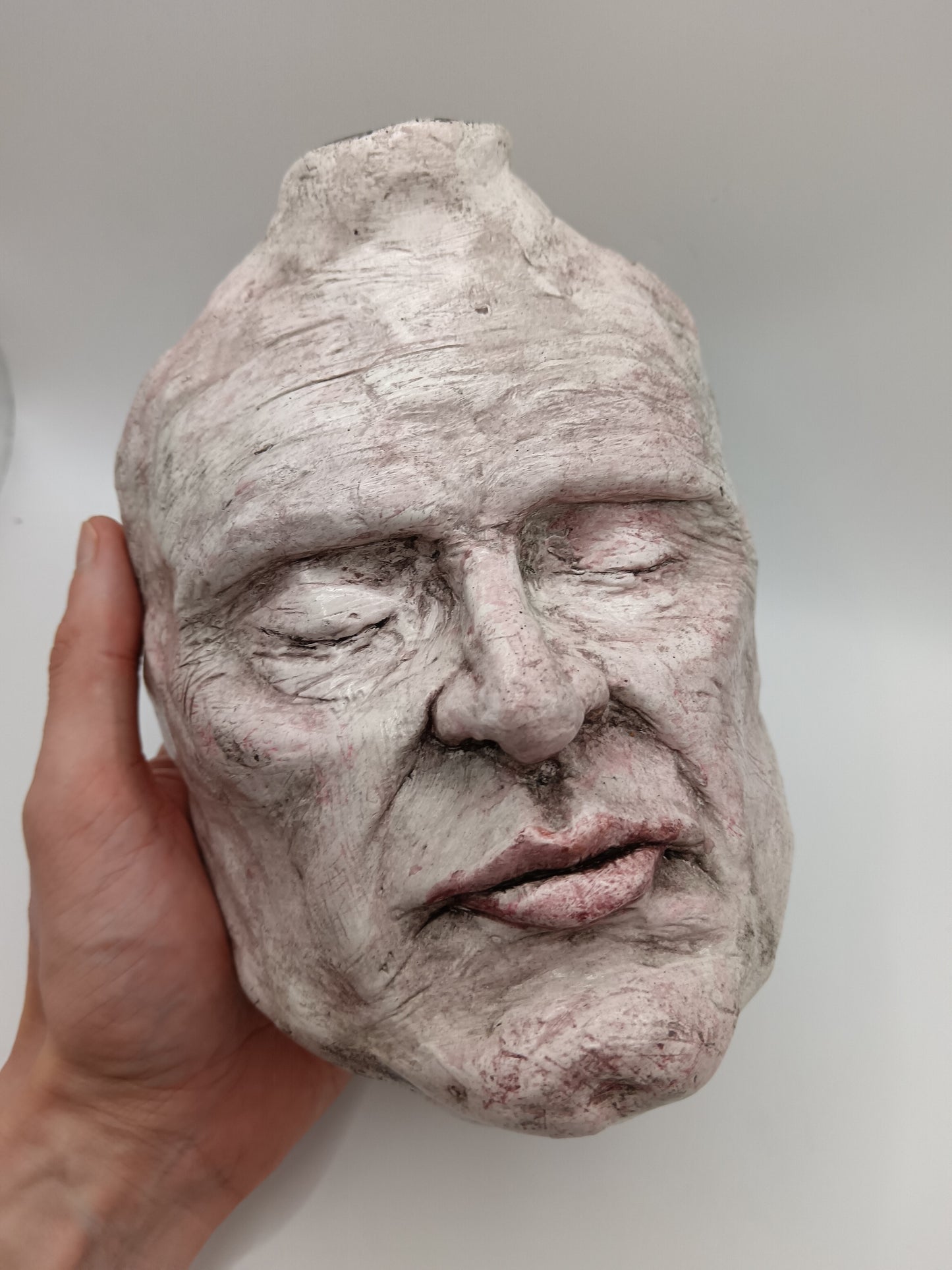 Francis Underwater Airy dry clay vase - male face, hand size comparison