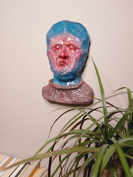 handmade clay alien sculpture, home setting wall mounted