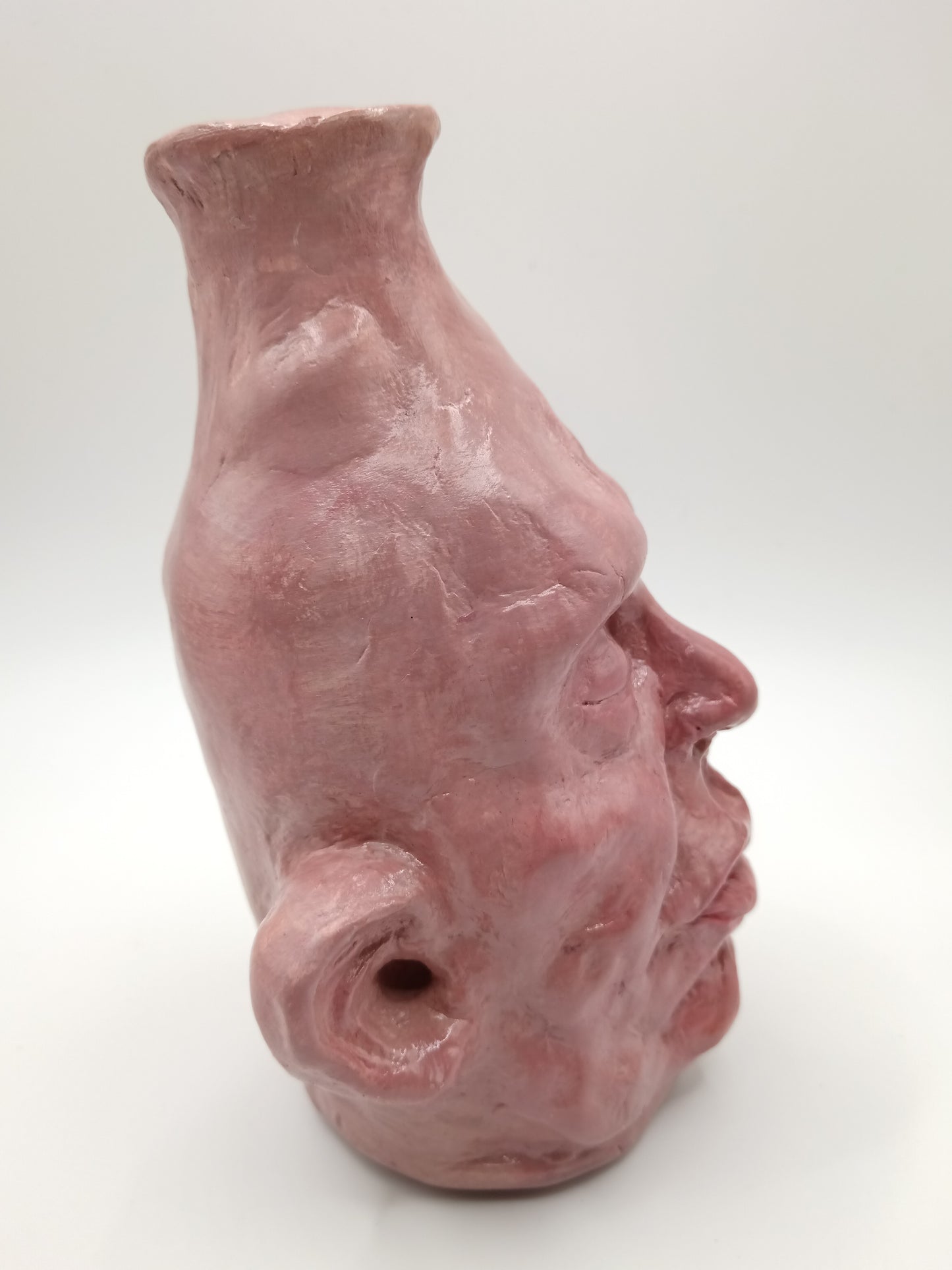 handmade closed-eye clay face vase, right view