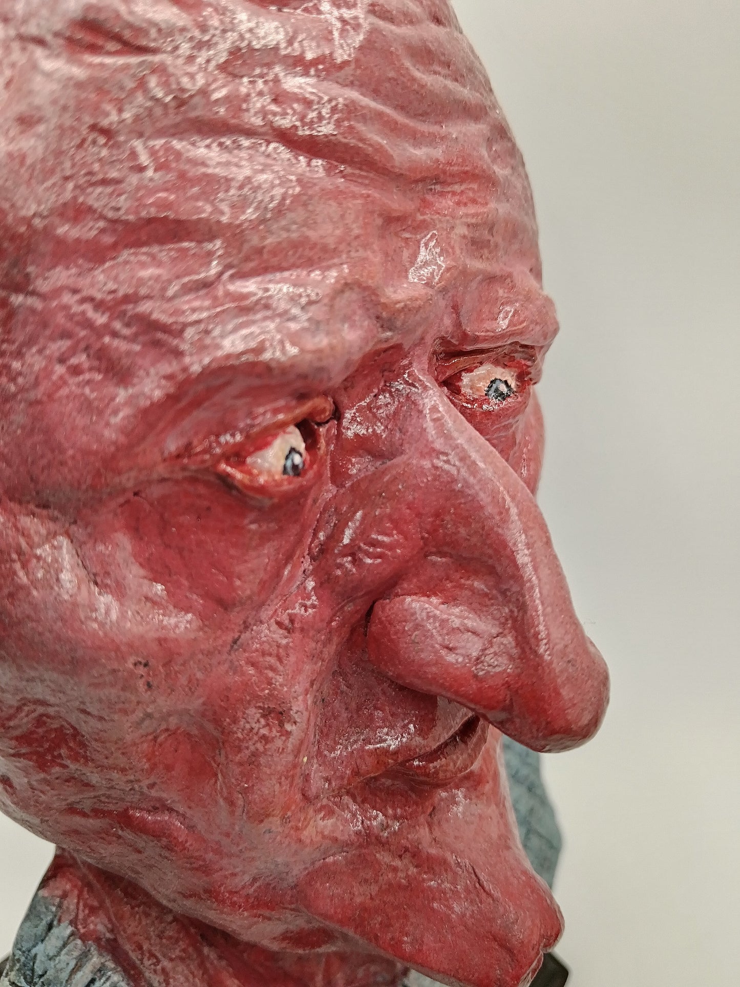 handmade airdry clay alien sculpture, close-up