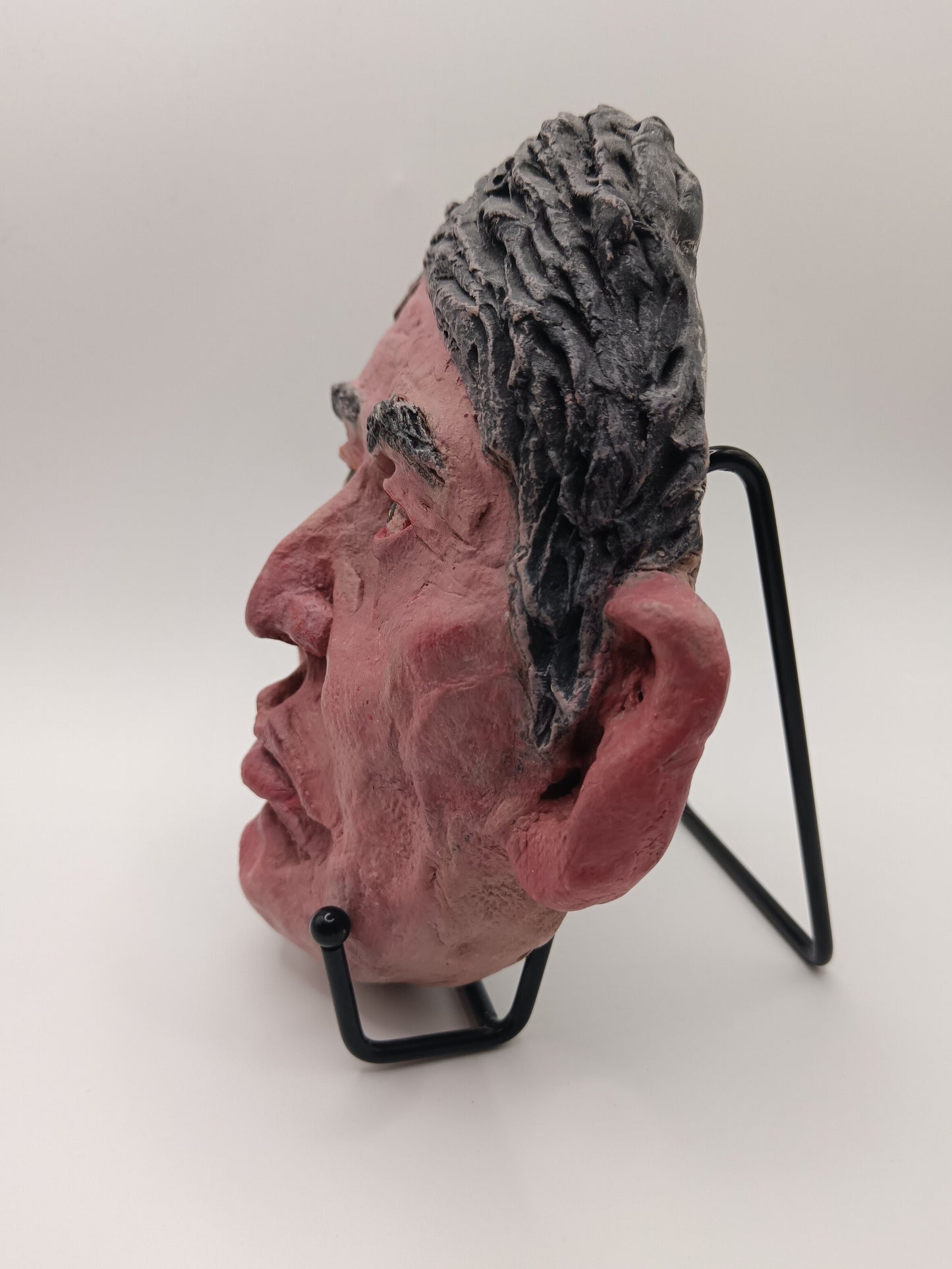 male clay sculpture with stand left view