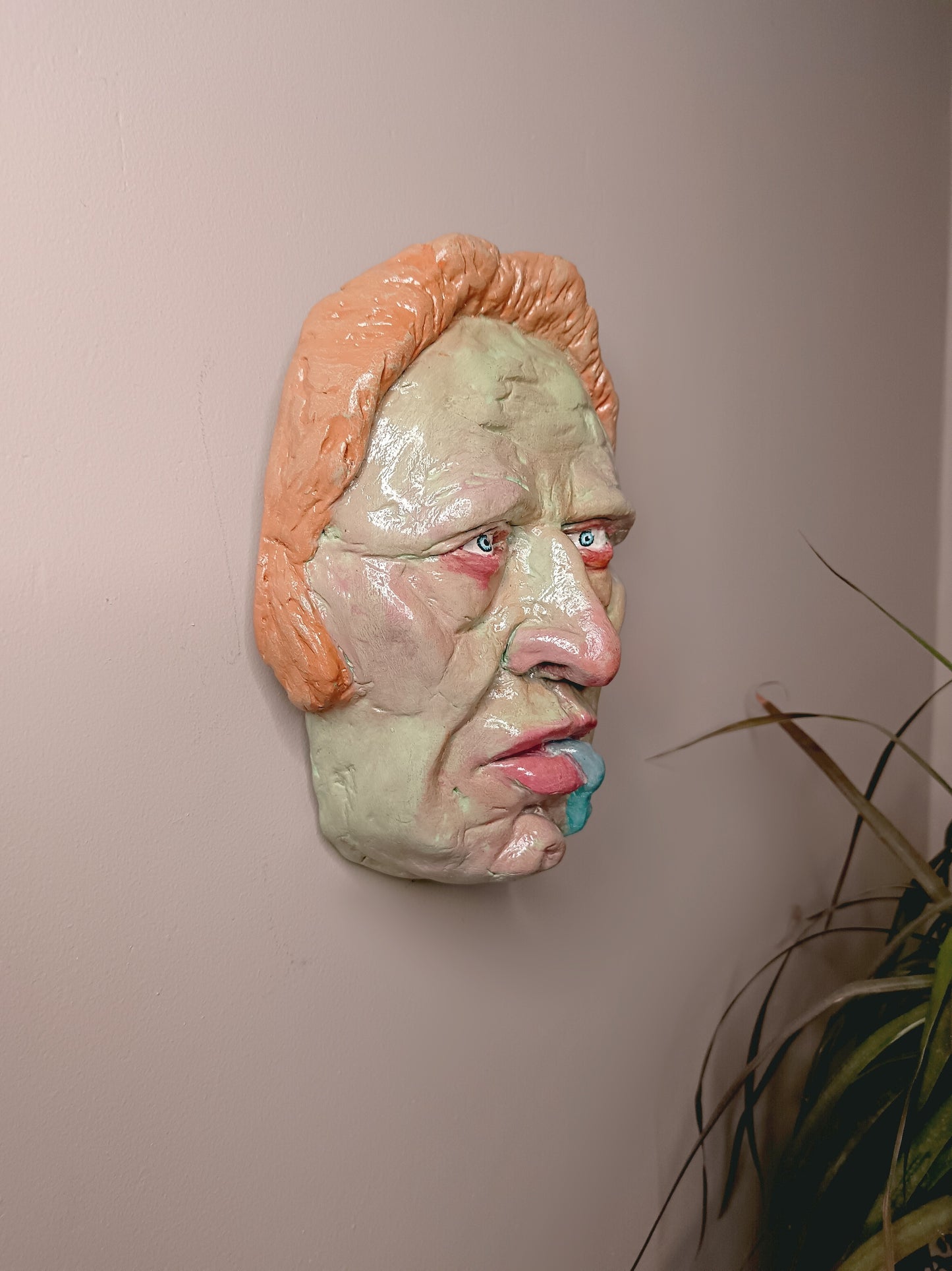 hand sculpted lizard man clay sculpture wall art side