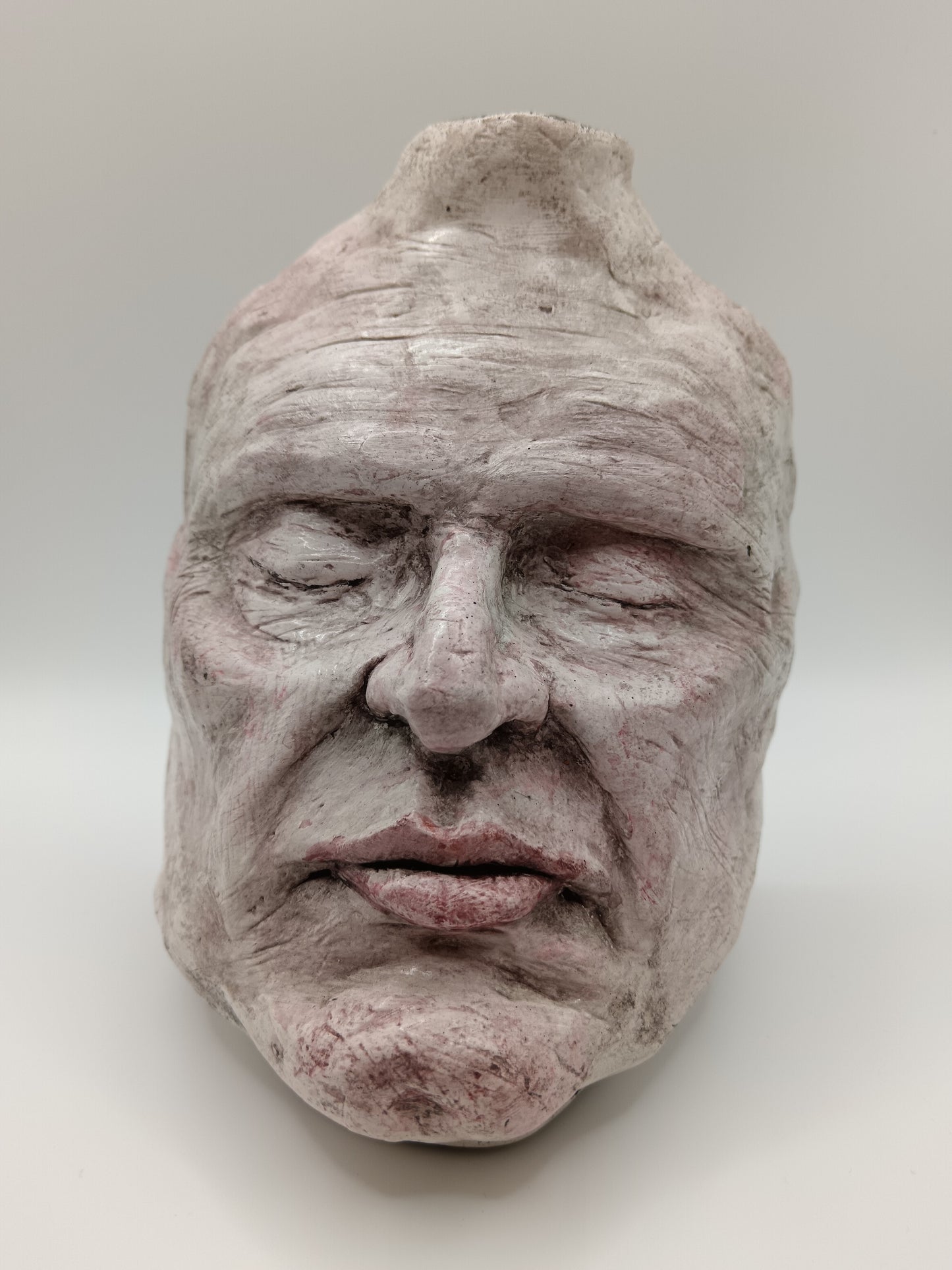 Airy dry clay vase - male face, Front