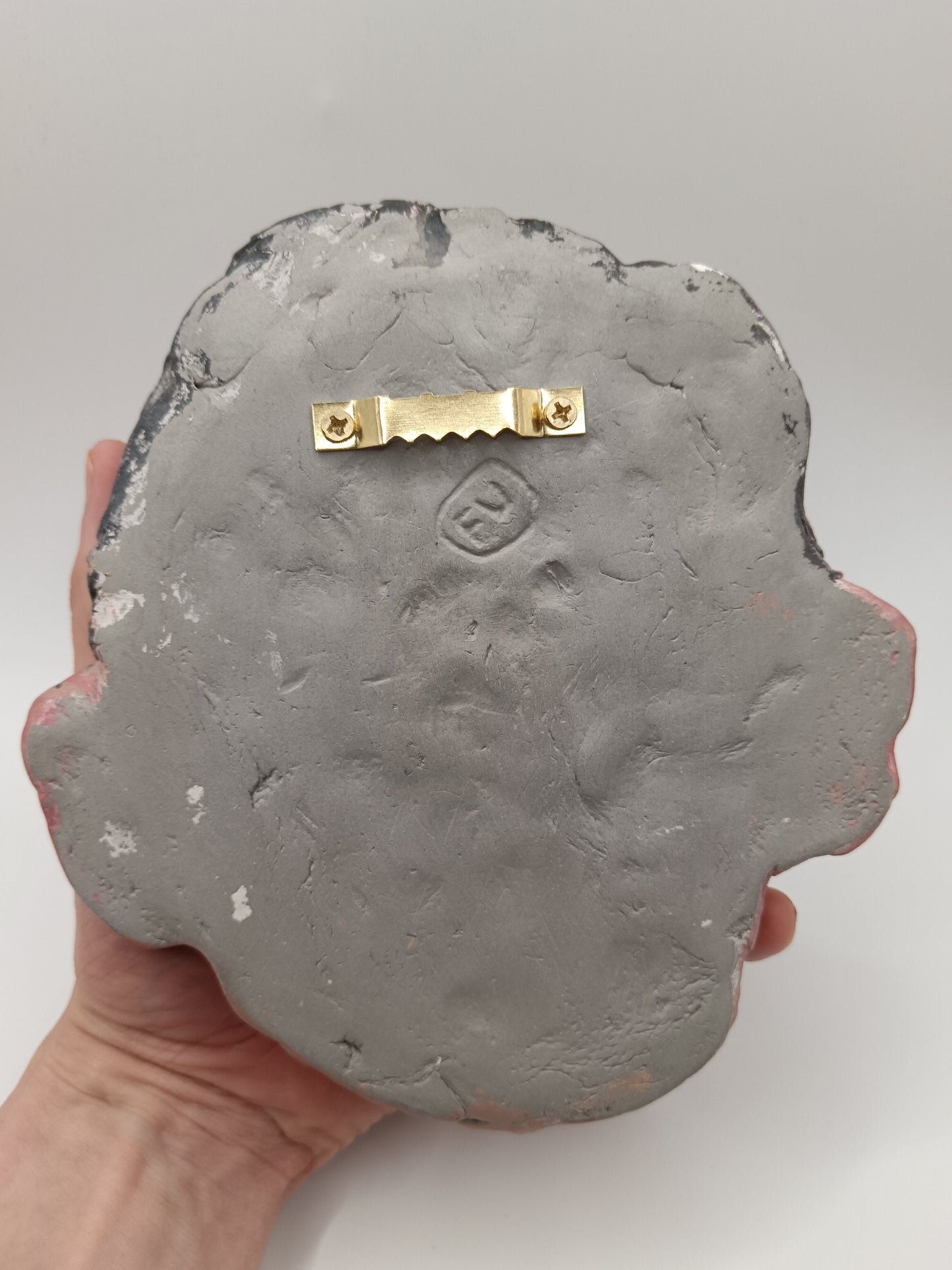 back of sculpture with sawtooth hanger