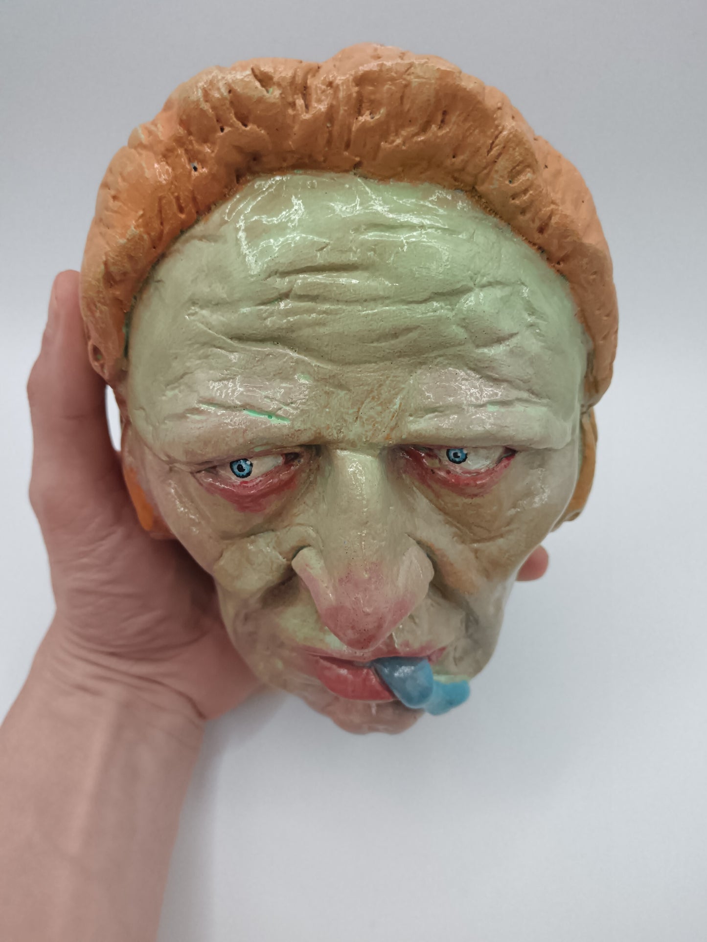 hand sculpted lizard man clay sculpture top