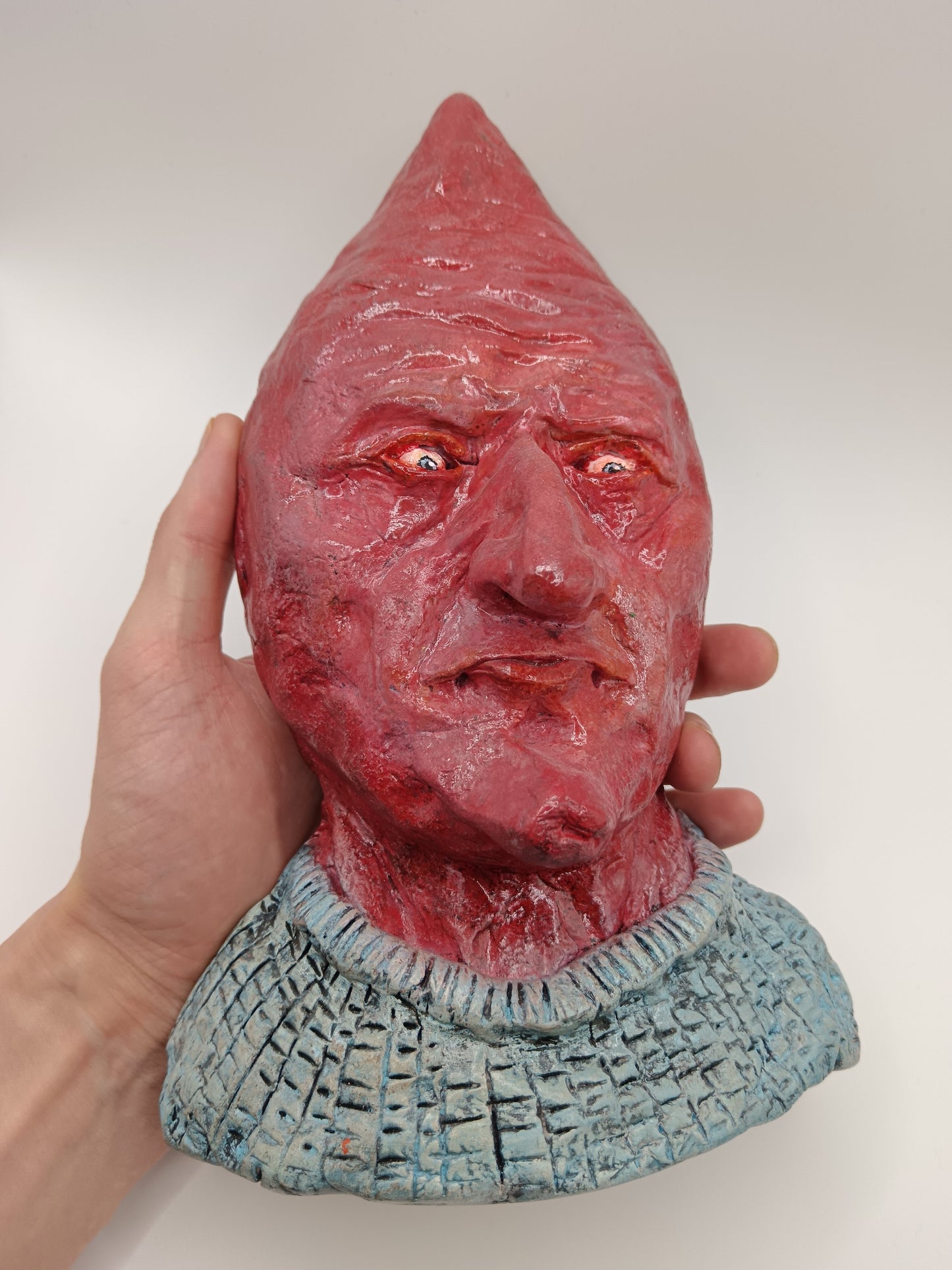 handmade airdry clay alien sculpture, front hand