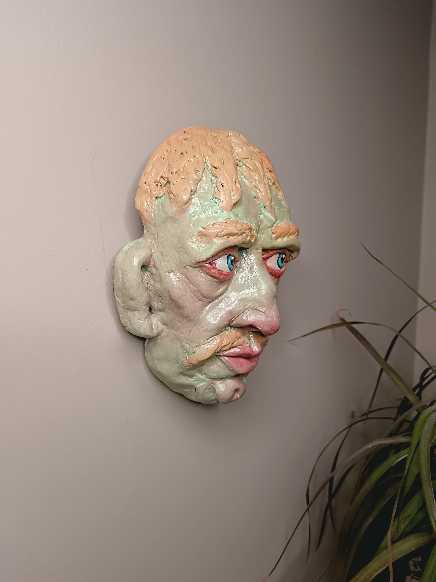 Hand sculpted green man sculpture wall art side