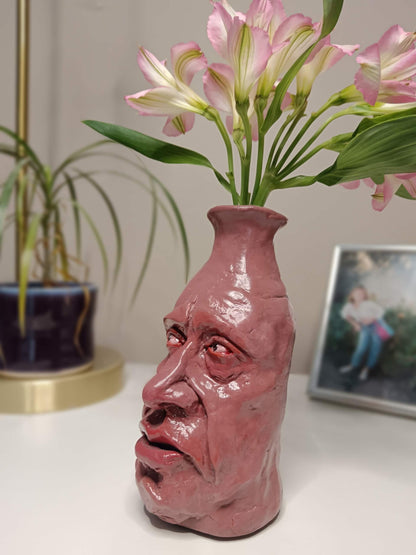 weird bud vase with face
