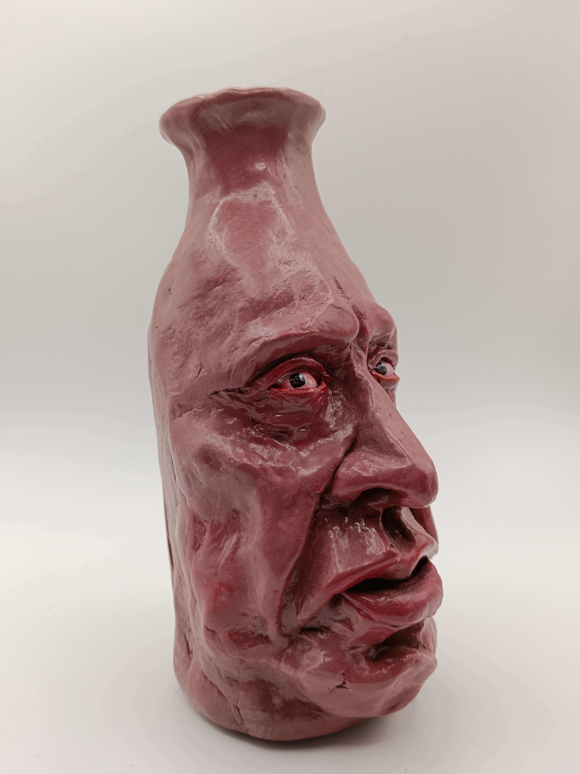 hand sculpted clay face vase