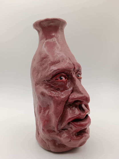 hand sculpted clay face vase