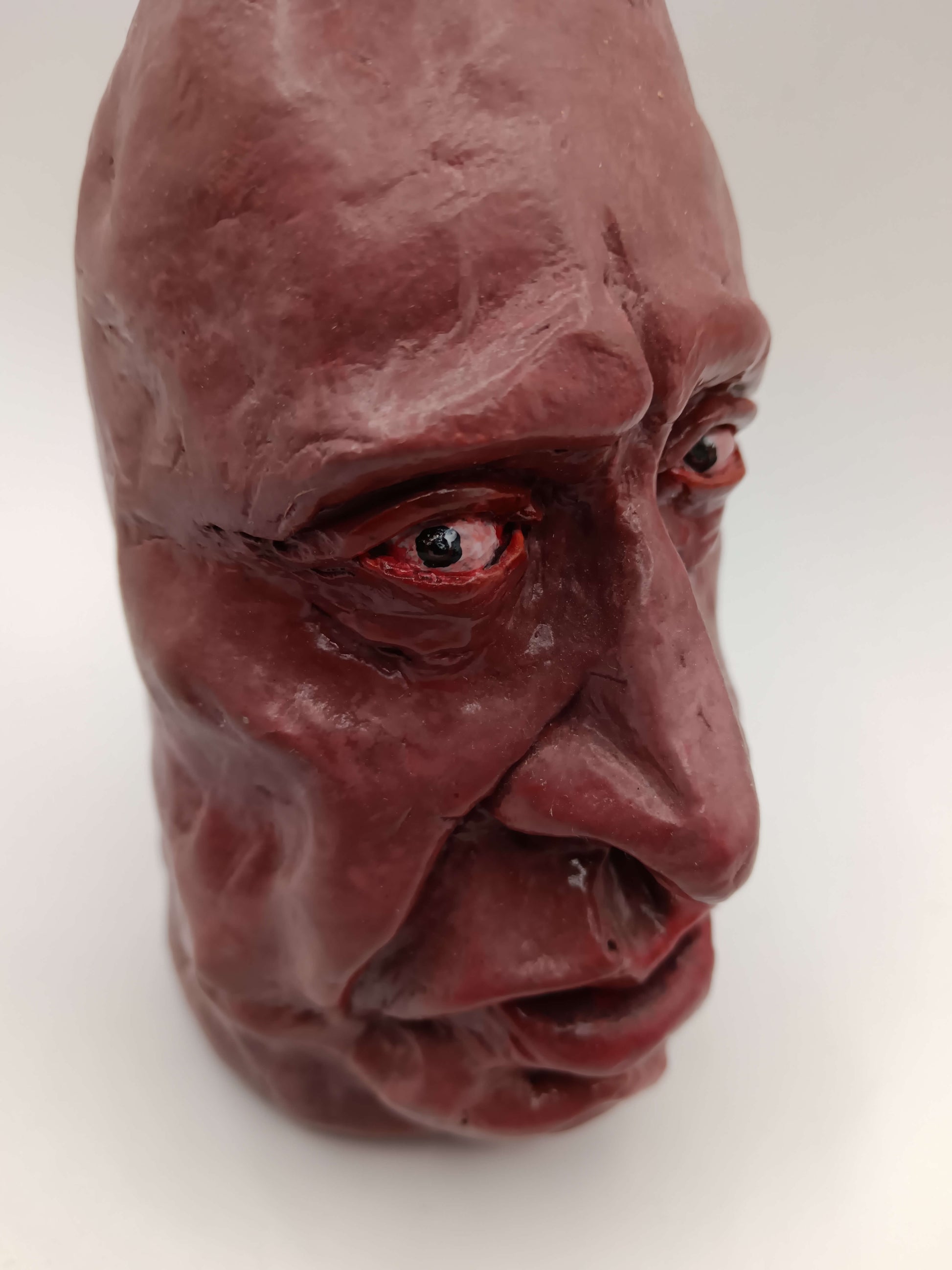close up of clay portrait sculpture